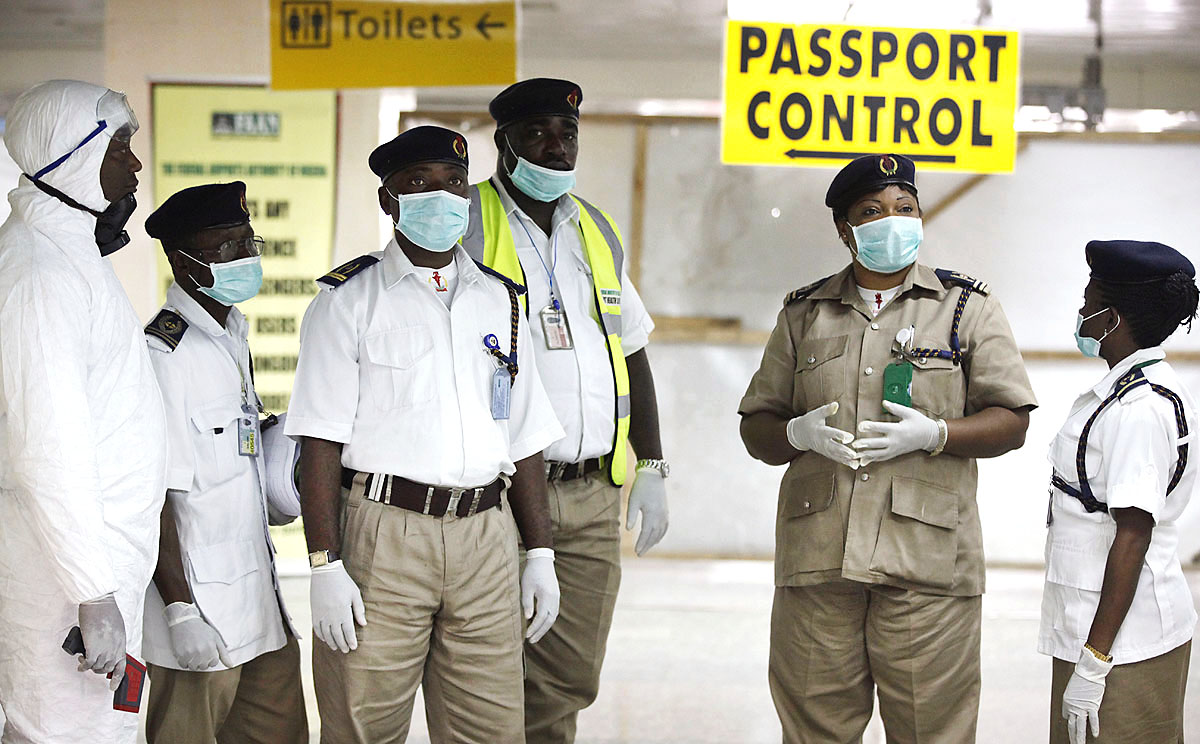 Nigerian health officials wait to screen passengers for Ebola at the arrival hall of Murtala Muhammed International Airport in Lagos. Photo: AP