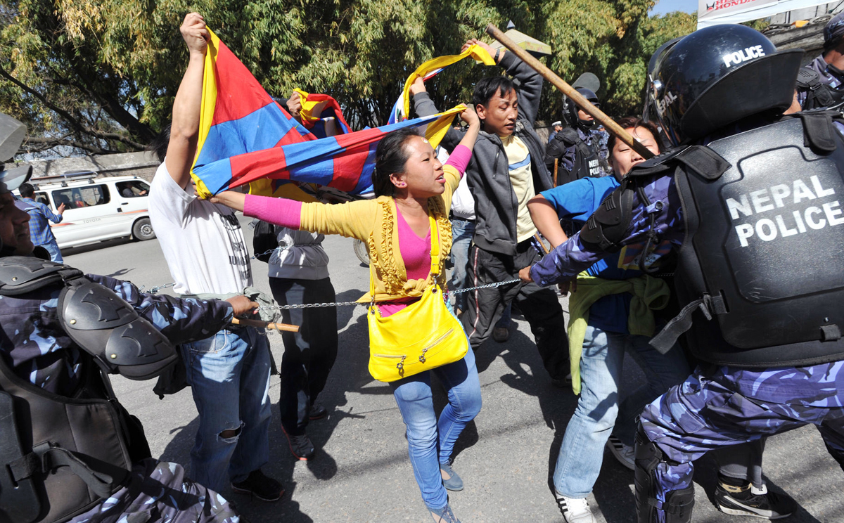 Nepalese riot police arrest Tibetans during a protest in Kathmandu in 2012 to mark the 53rd anniversary of the 1959 Tibetan uprising against Chinese rule. Photos: AP