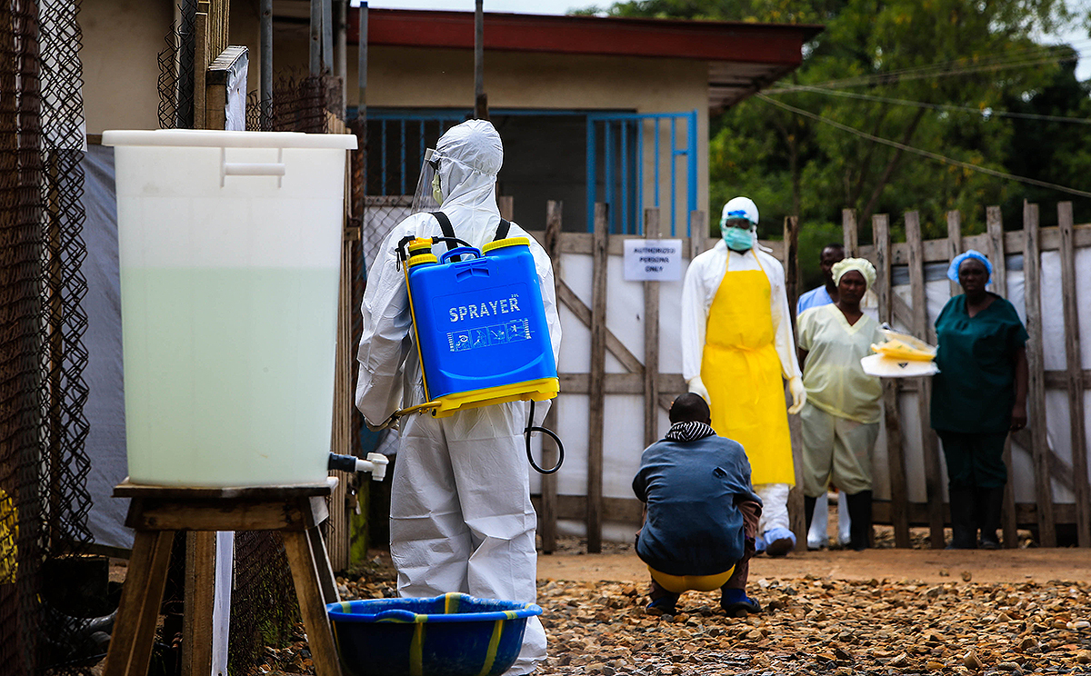 A medical worker is seen outside an Ebola treatment centre at the government hospital in Kenema, eastern Sierra Leone. Photo: Xinhua
