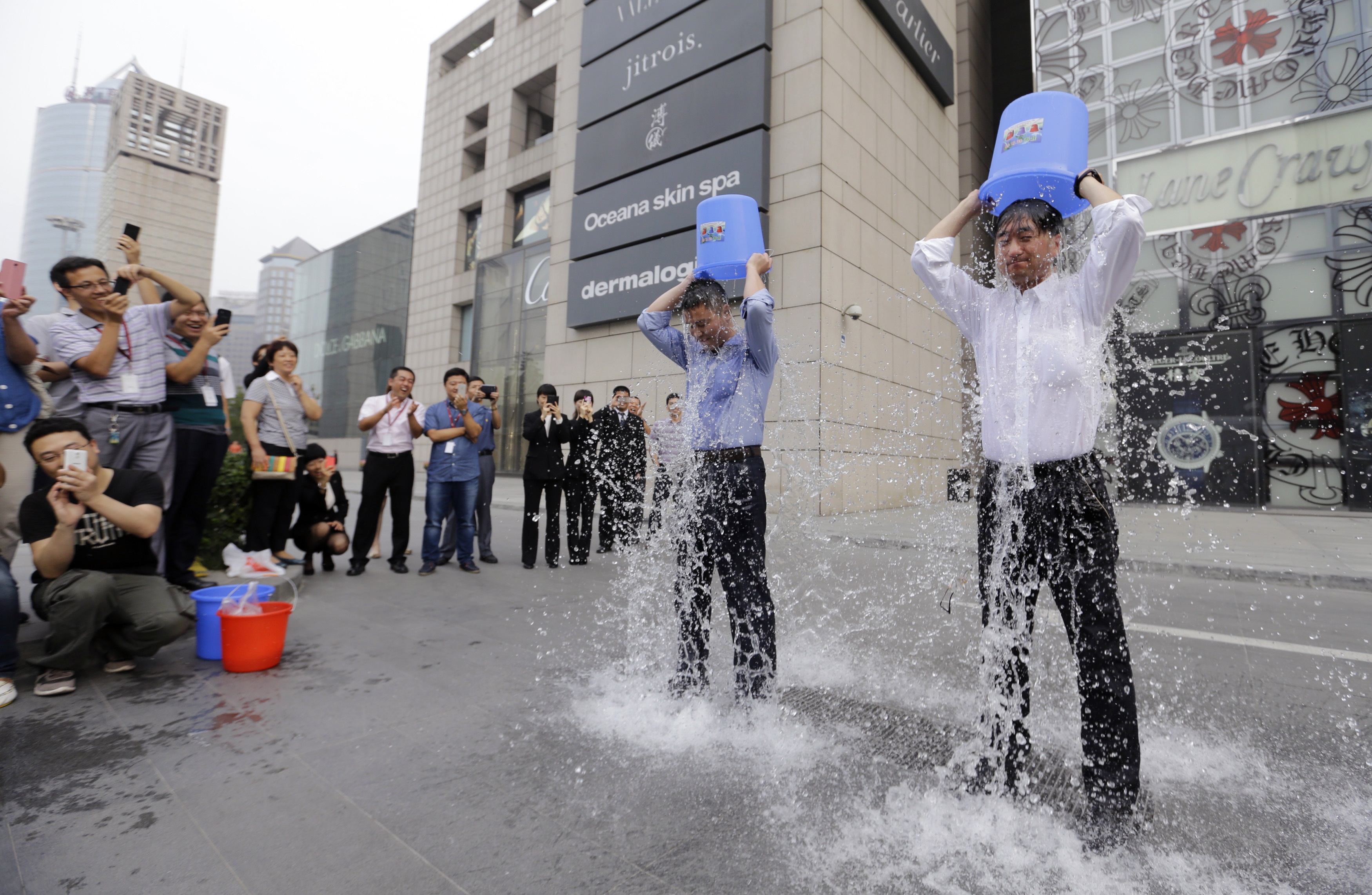 The viral "Ice Bucket Challenge" is all over the tech sphere in China. Photo: Reuters