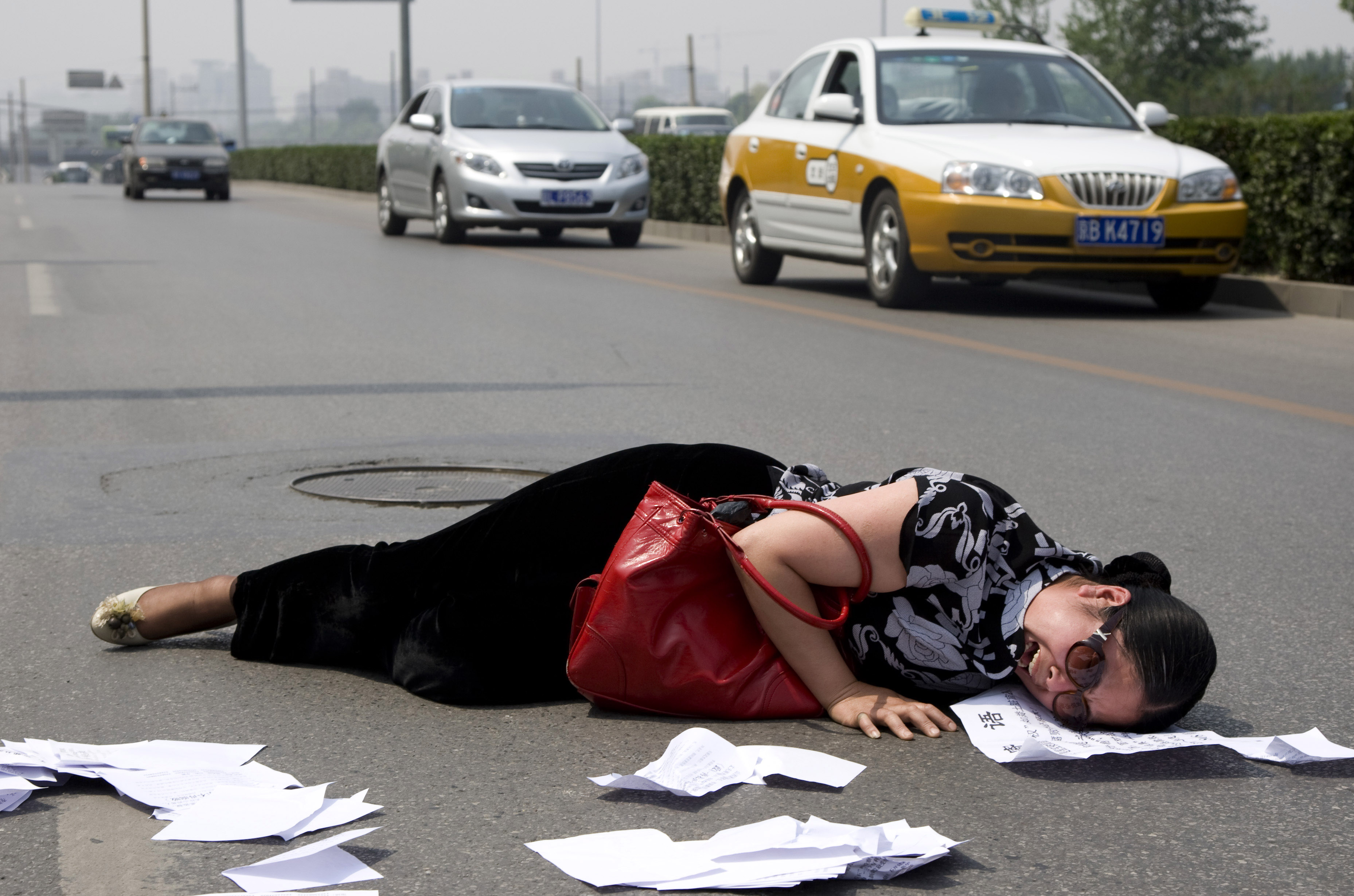 A distraught petitioner in Beijing. Local government officials have been known to forcefully prevent petitioners from lodging a complaint. Photo: AP