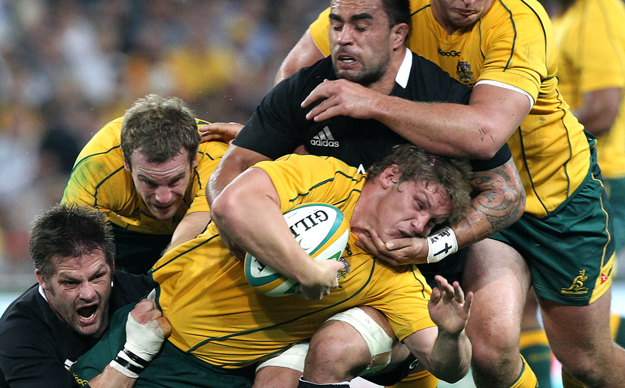 Australia’s Pat McCabe in the thick of the action against New Zealand during a Bledisloe Cup match in 2012, the year he suffered his first neck fracture while on tour in France. Photo: AP