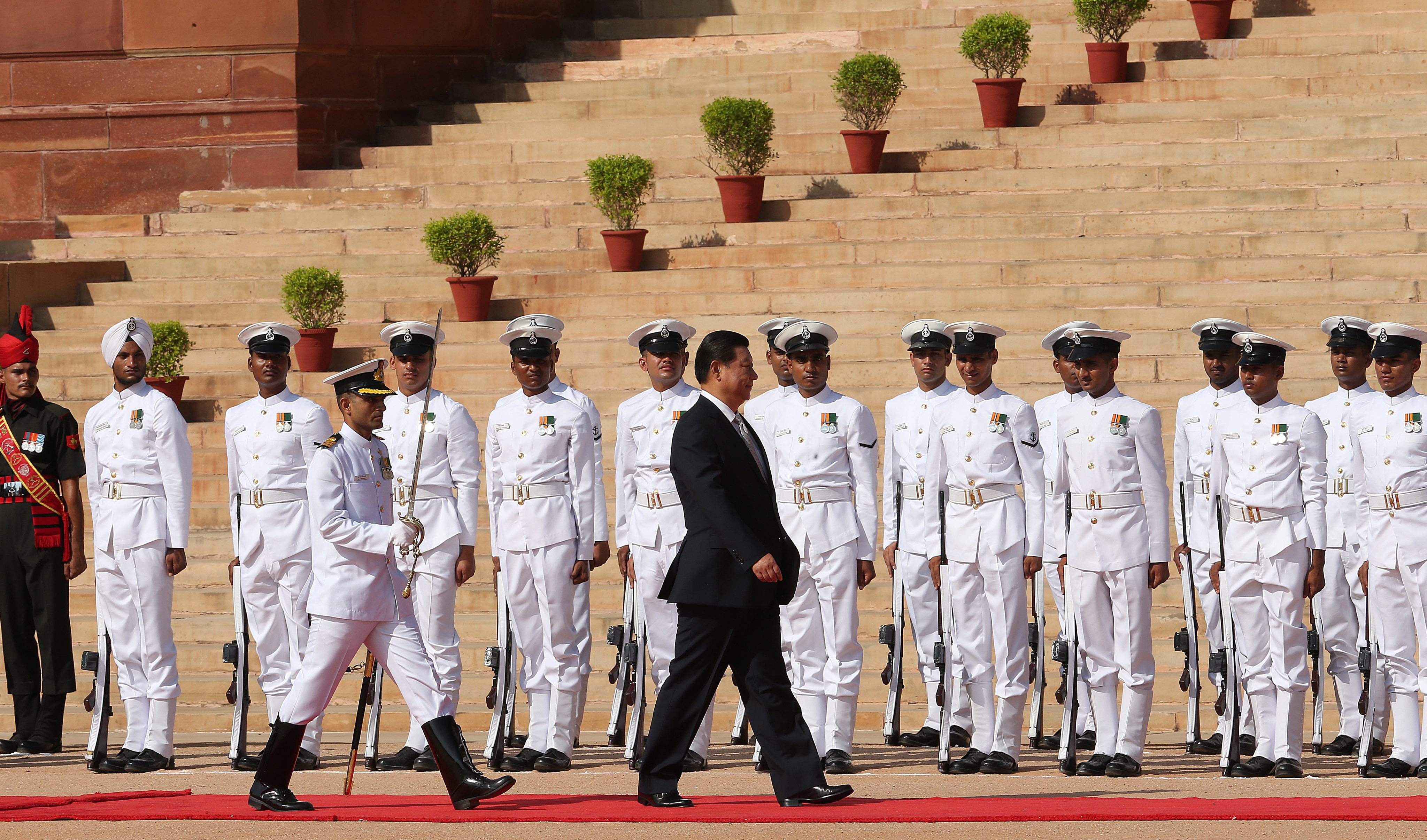 President Xi Jinping walks the red carpet at a welcome ceremony in New Delhi. Photo: EPA