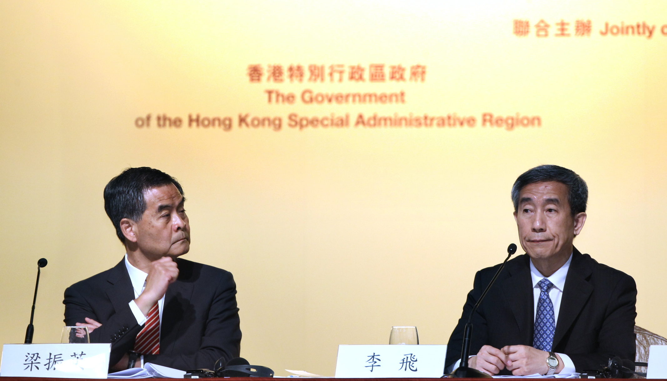 Hong Kong chief executive Leung Chun-ying and Li Fei, deputy secretary general of the NPC Standing Committee, explaining Beijing's stance. Photo: Dickson Lee