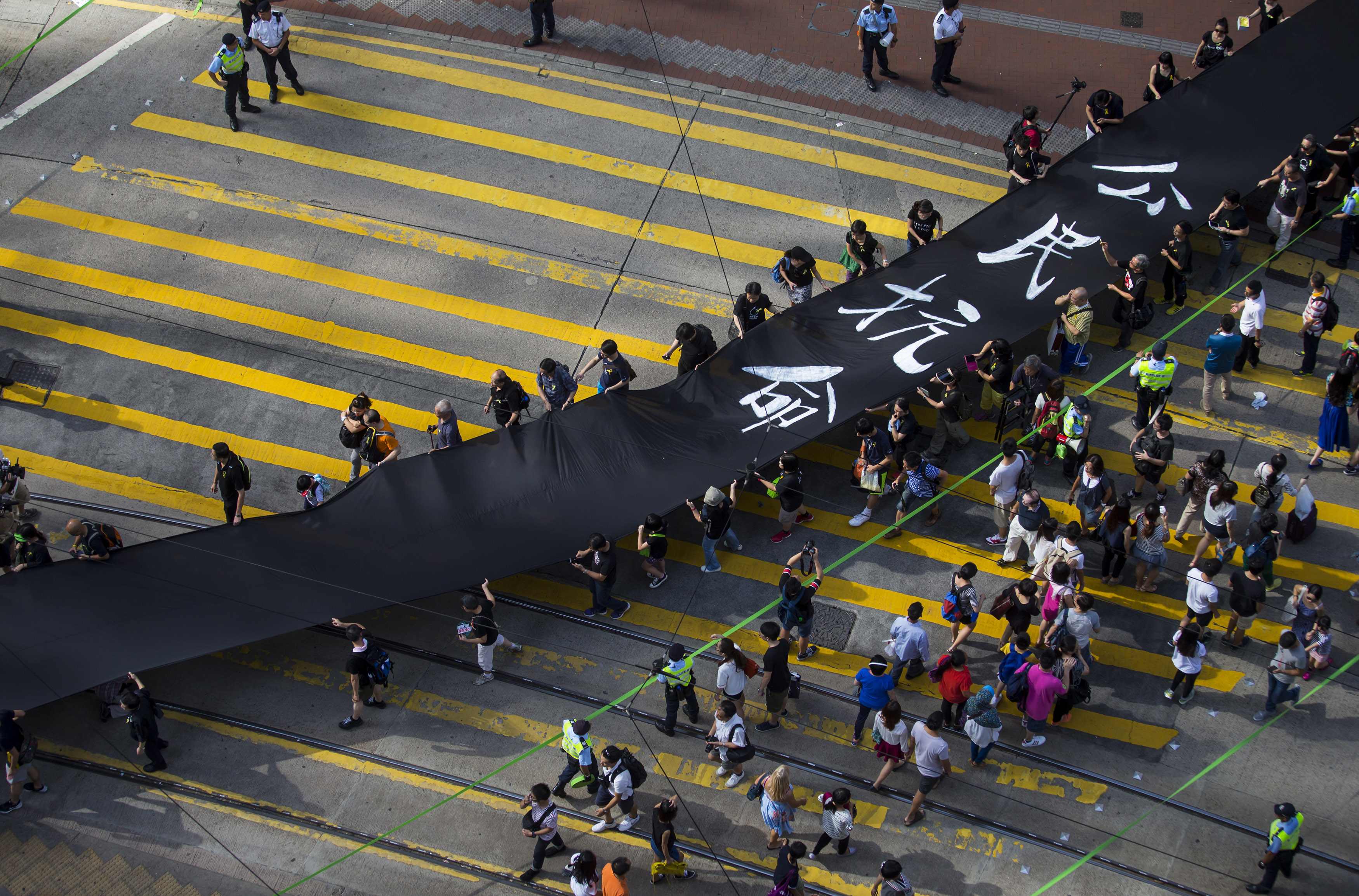 Occupy Central protesters marching this month, ahead of a planned blockade of streets in Central. Photo: Reuters
