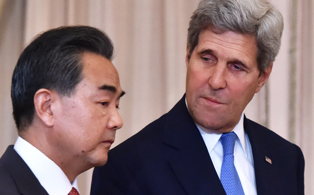 US Secretary of State John Kerry speaks alongside Chinese Foreign Minister Wang Yi (left) in Washington, D.C. on October 1, 2014. Photo: AFP