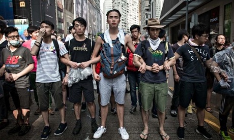 A human chain of student protestors to keep the peace. Photo: SCMP
