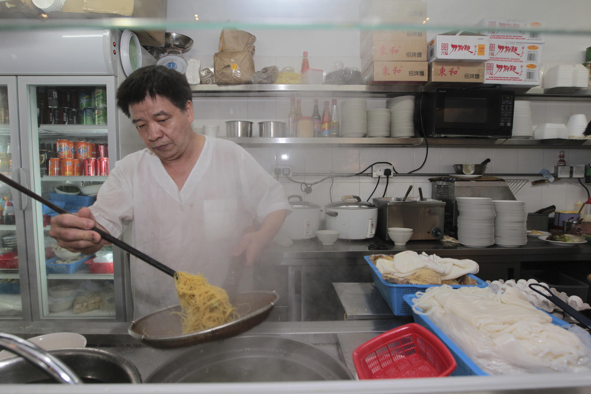Cooking noodles at House of Ho Yuen. Photos: Bruce Yan