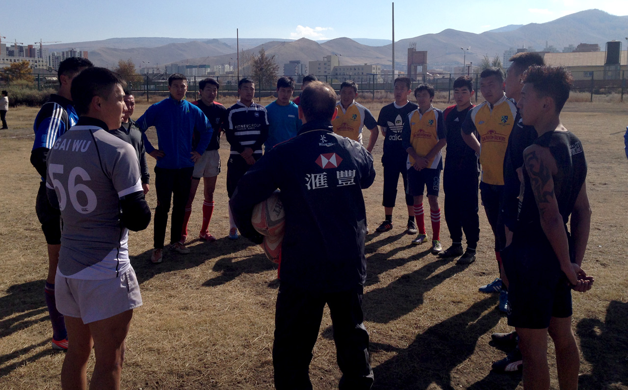 Hong Kong’s new national coach development manager Peter Drewett talks tactics with the Mongolia national 15s side at their Ulan Bator training ground. Photos: Andy Hall