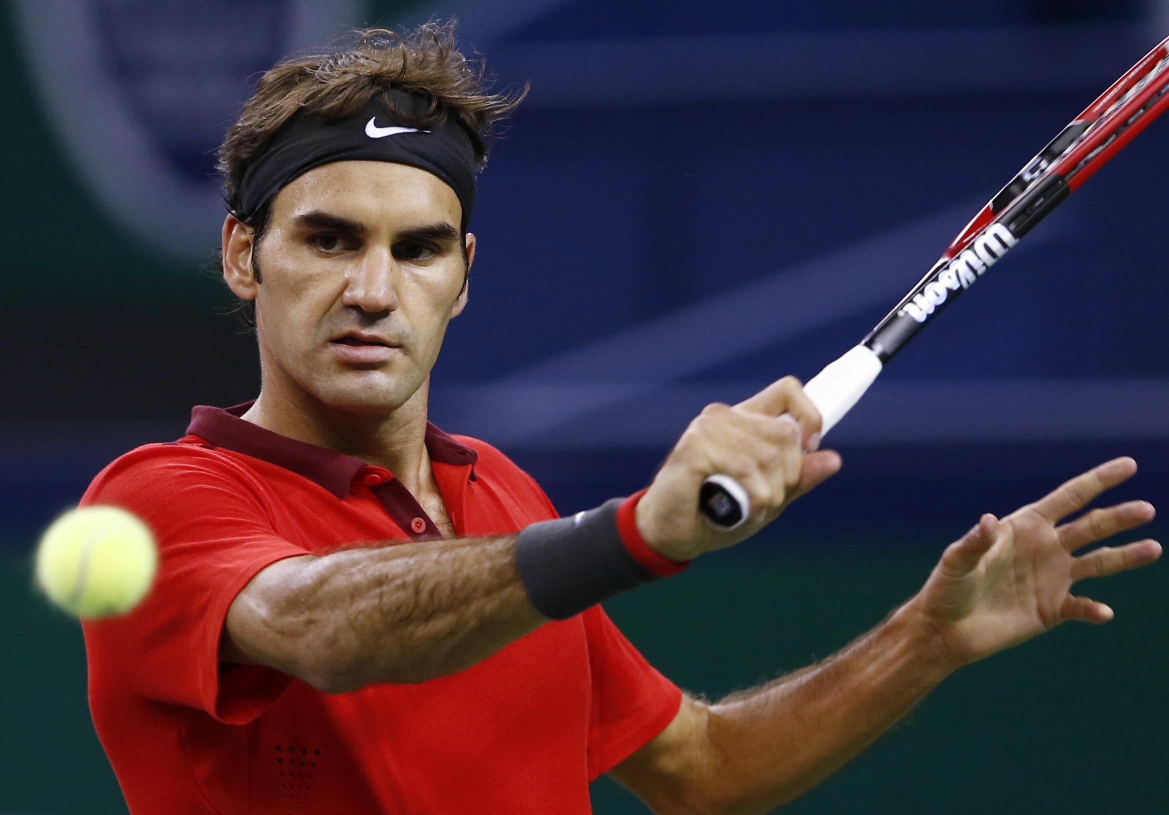 Roger Federer returns a shot during his singles match against Julien Benneteau of France at the Shanghai Masters. Photo:  Reuters 