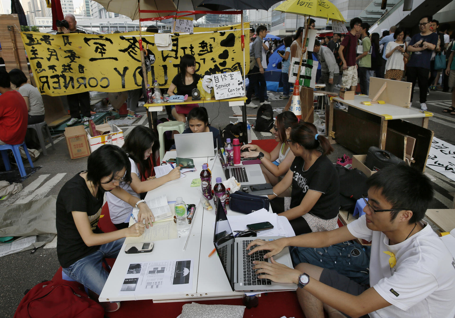 Pro-democracy students do their homework at a study area. Photo: AP