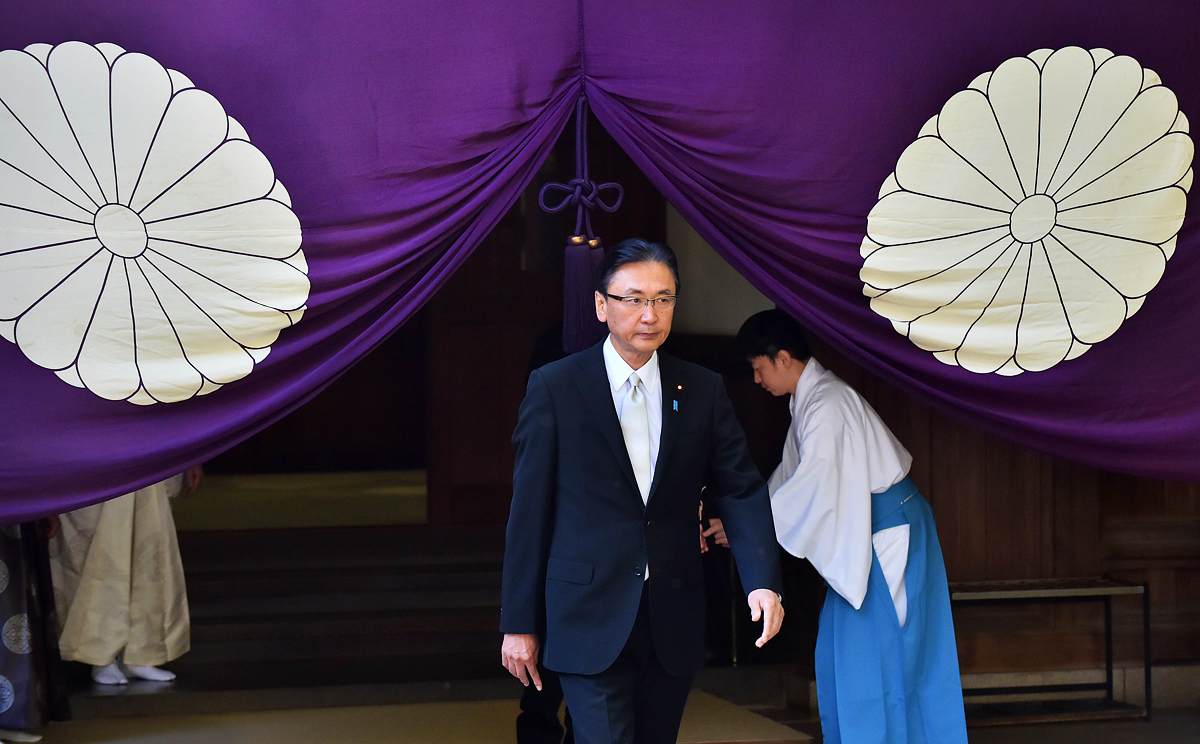 Japanese former state minister Keiji Furuya leaves the Yasukuni shrine on Friday. More than 100  lawmakers visited the shrine condemned by China and Korea as a symbol of Japan's militarist past. AFP