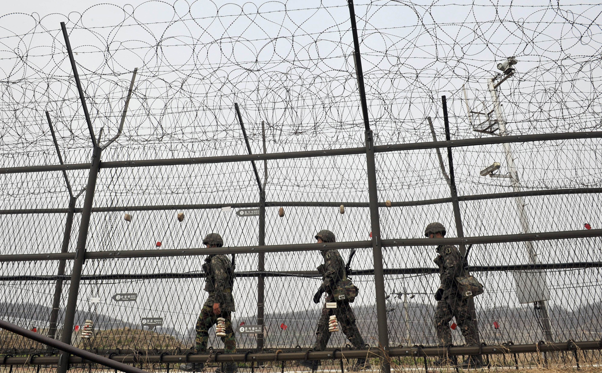 South Korean soldiers patrol along a military fence near the Demilitarised Zone (DMZ) dividing the two Koreas in this file picture. Photo: AFP