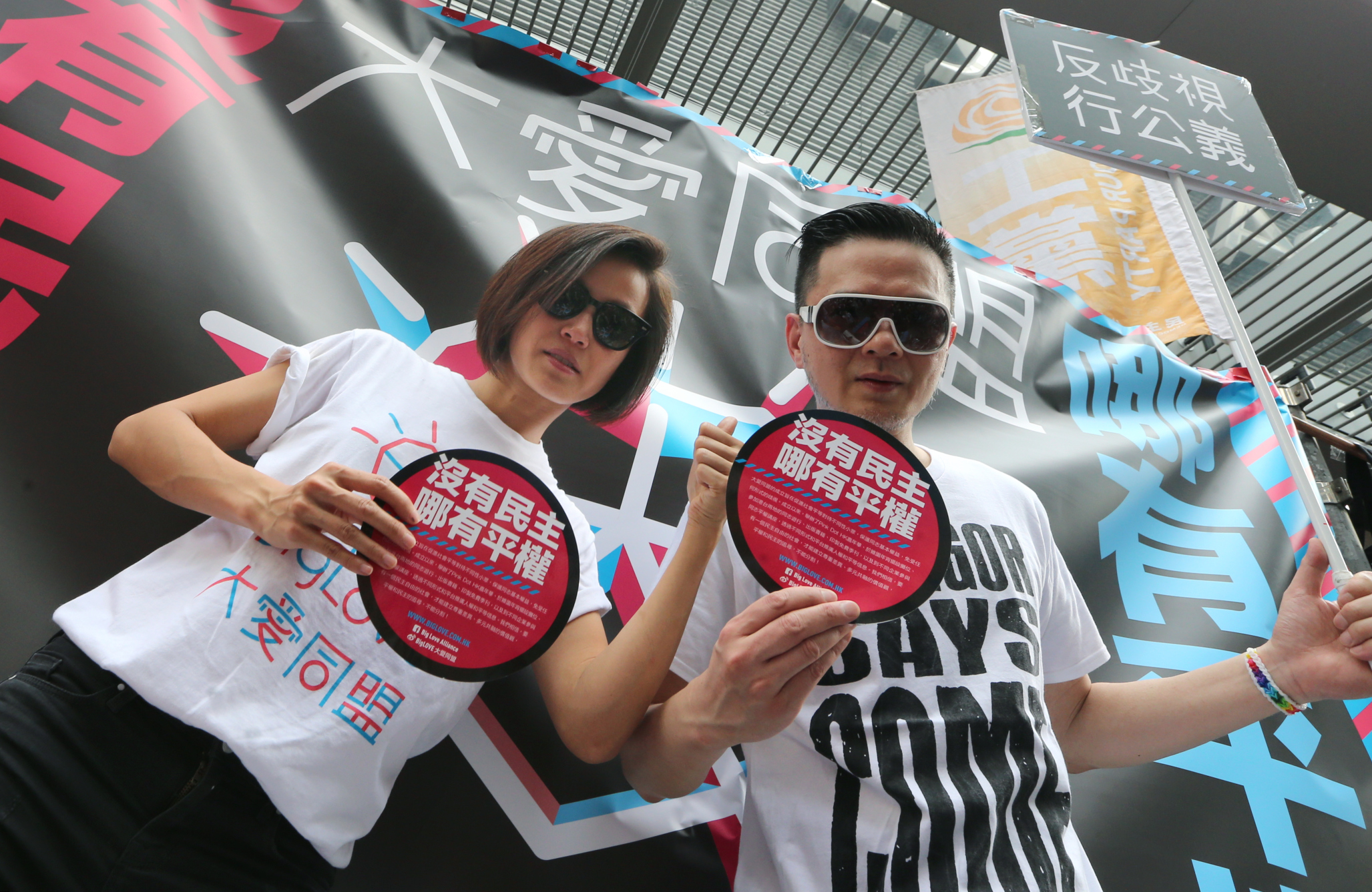 Canto-pop singers Denise Ho Wan-sze (left) and Anthony Wong Yiu-ming join a march in the streets to demand universal suffrage in Hong Kong. Photo: David Wong