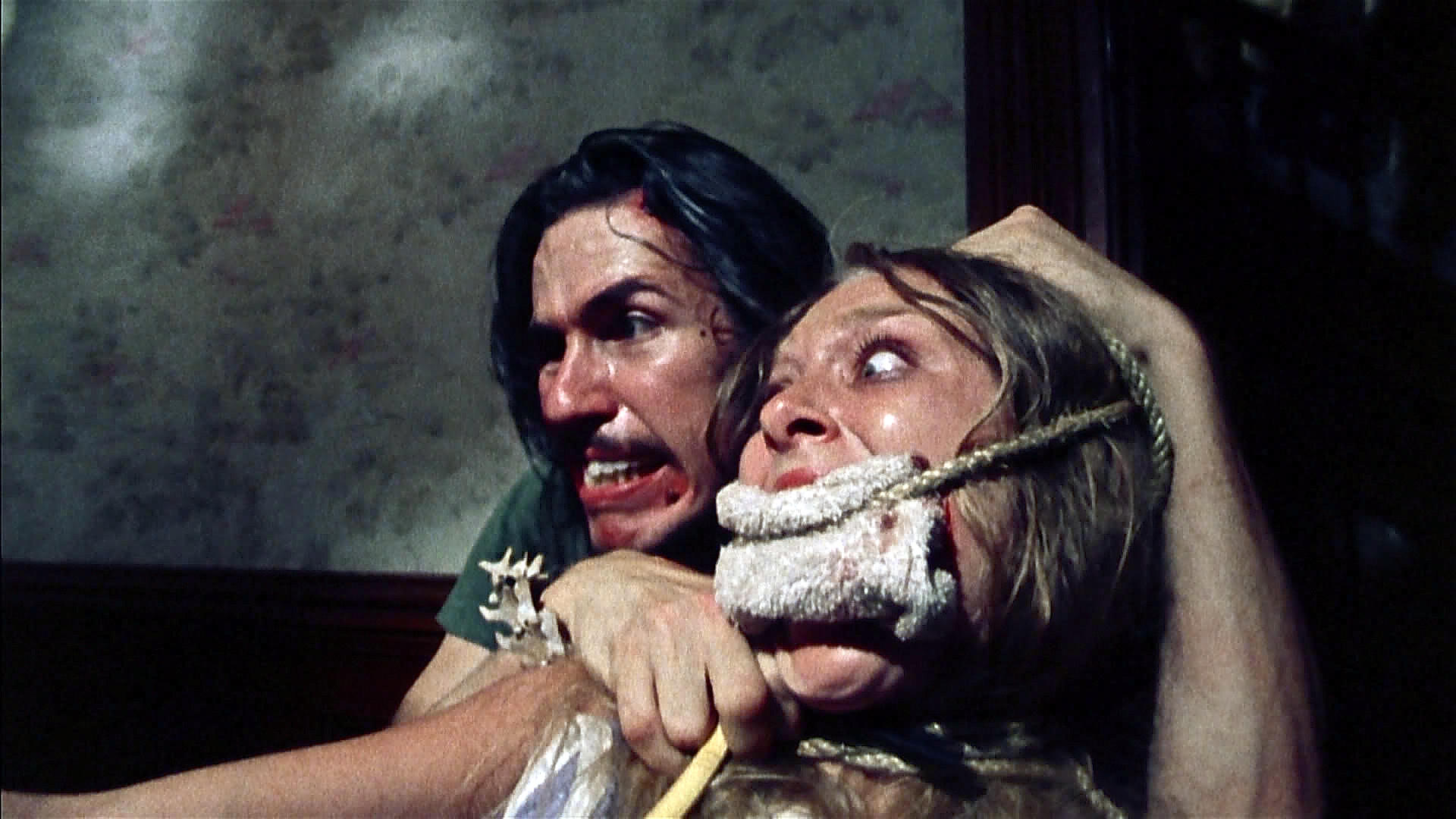 Edwin Neal menaces Marilyn Burns in one of the scenes that helped set a new benchmark in gothic horror. 