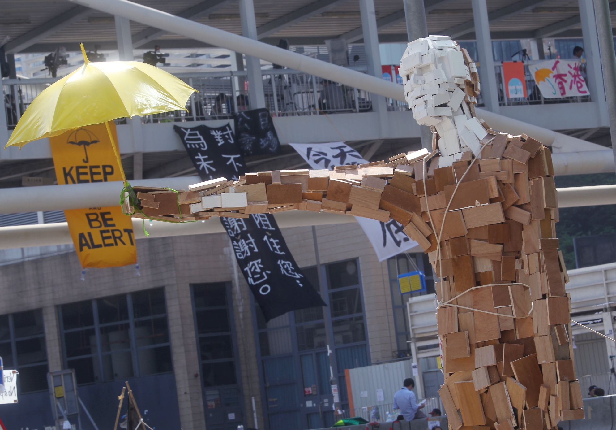 The statue "Umbrella Man" by the Hong Kong artist known as Milk, stands at a protest site next to the central government offices in Admiralty. Photo: SCMP/May Tse