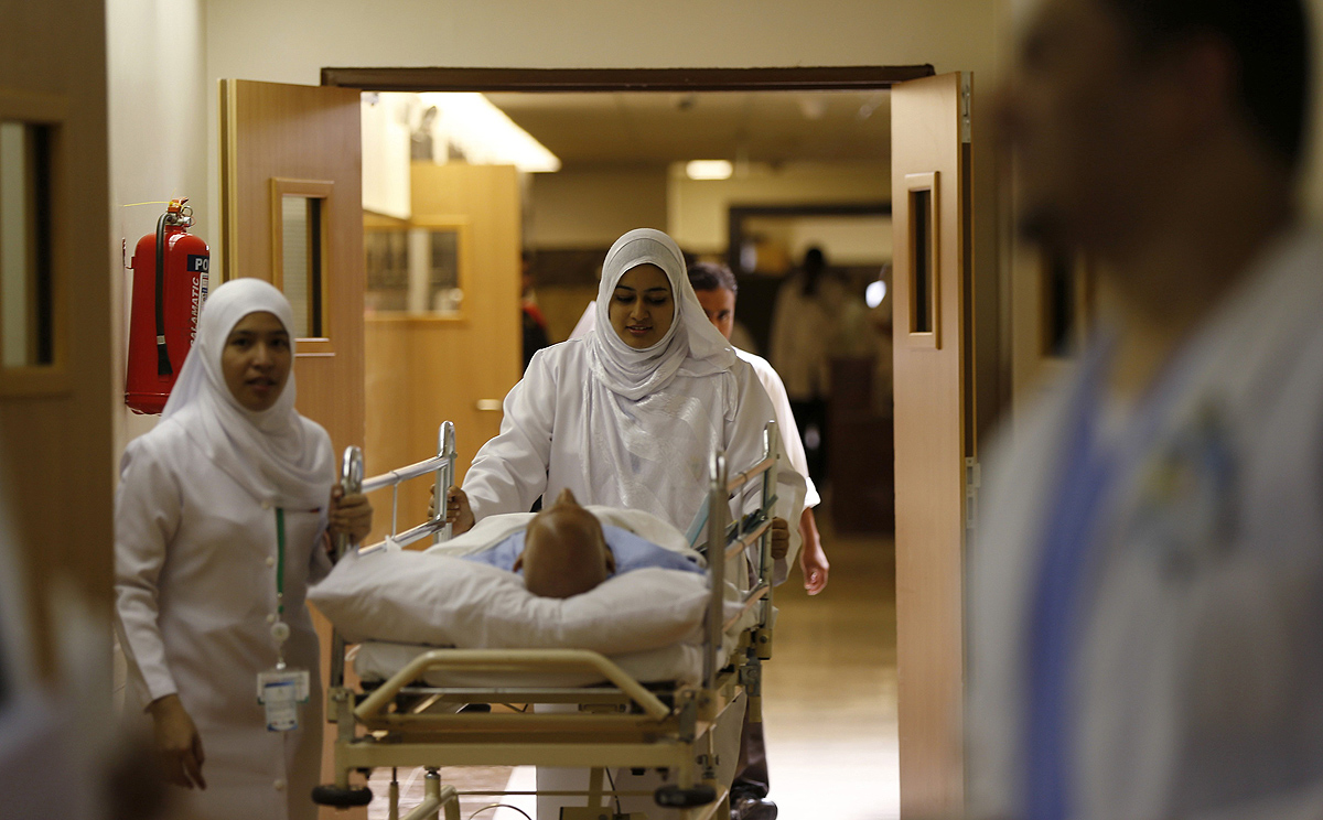 Nurses wheel a patient into the emergency department at Al-Noor Specialist Hospital in Mecca. Photo: Reuters