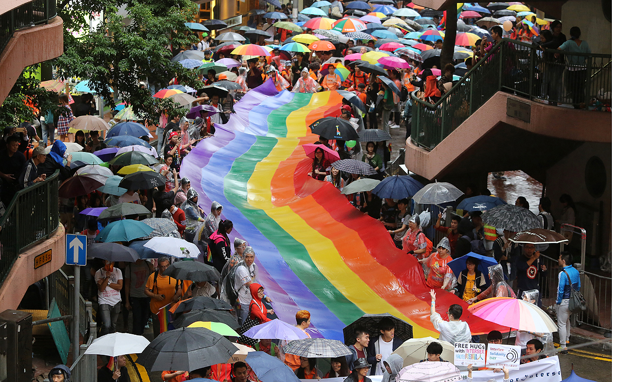 Participants carry a rainbow flag in Causeway Bay as part of the gay pride parade. Photo: Sam Tsang
