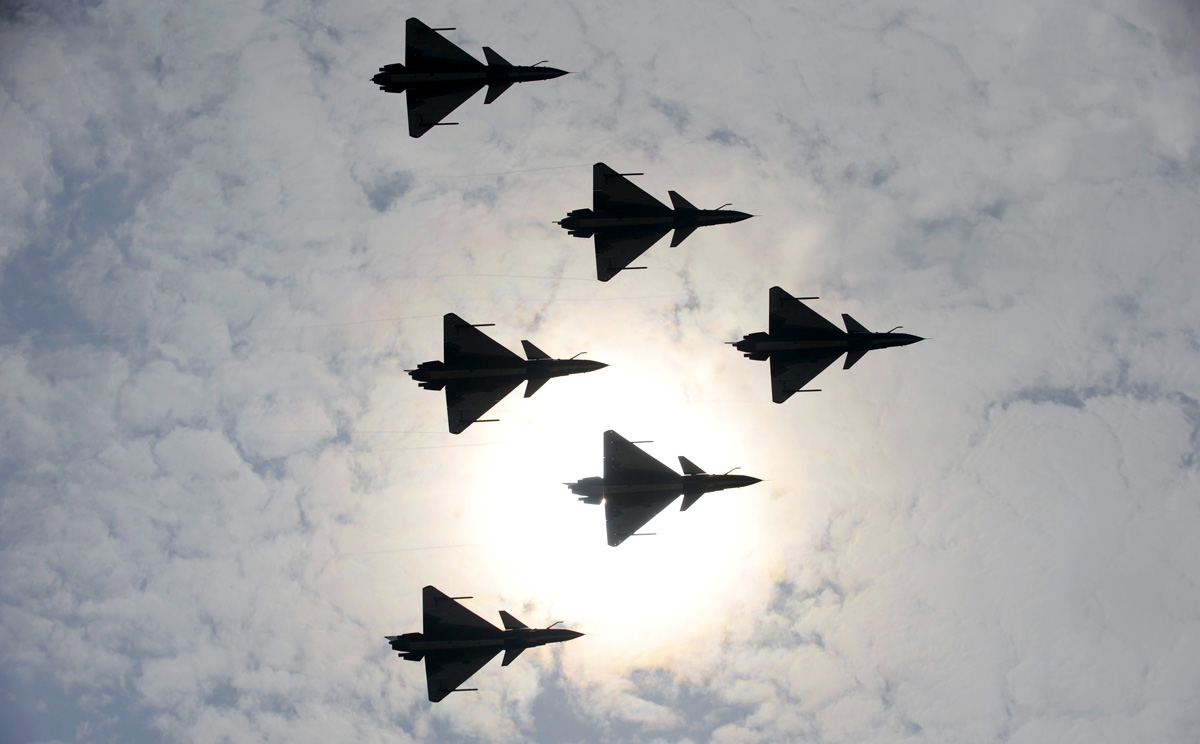 J-10 jet fighters of the PLA Air Force aerobatic team perform at the Zhuhau airshow. Some 700 foreign and domestic exhibitors with 130-plus planes are due to attend the event this week. Photo: Xinhua 
