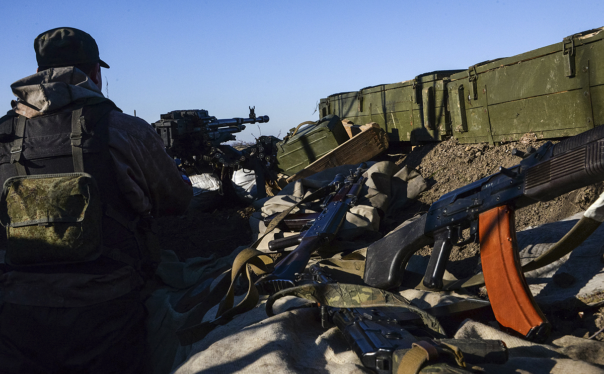 A pro-Russian rebel fires a Russian designed machine gun toward Ukrainian army positions near Donetsk on Friday. Photo: AP