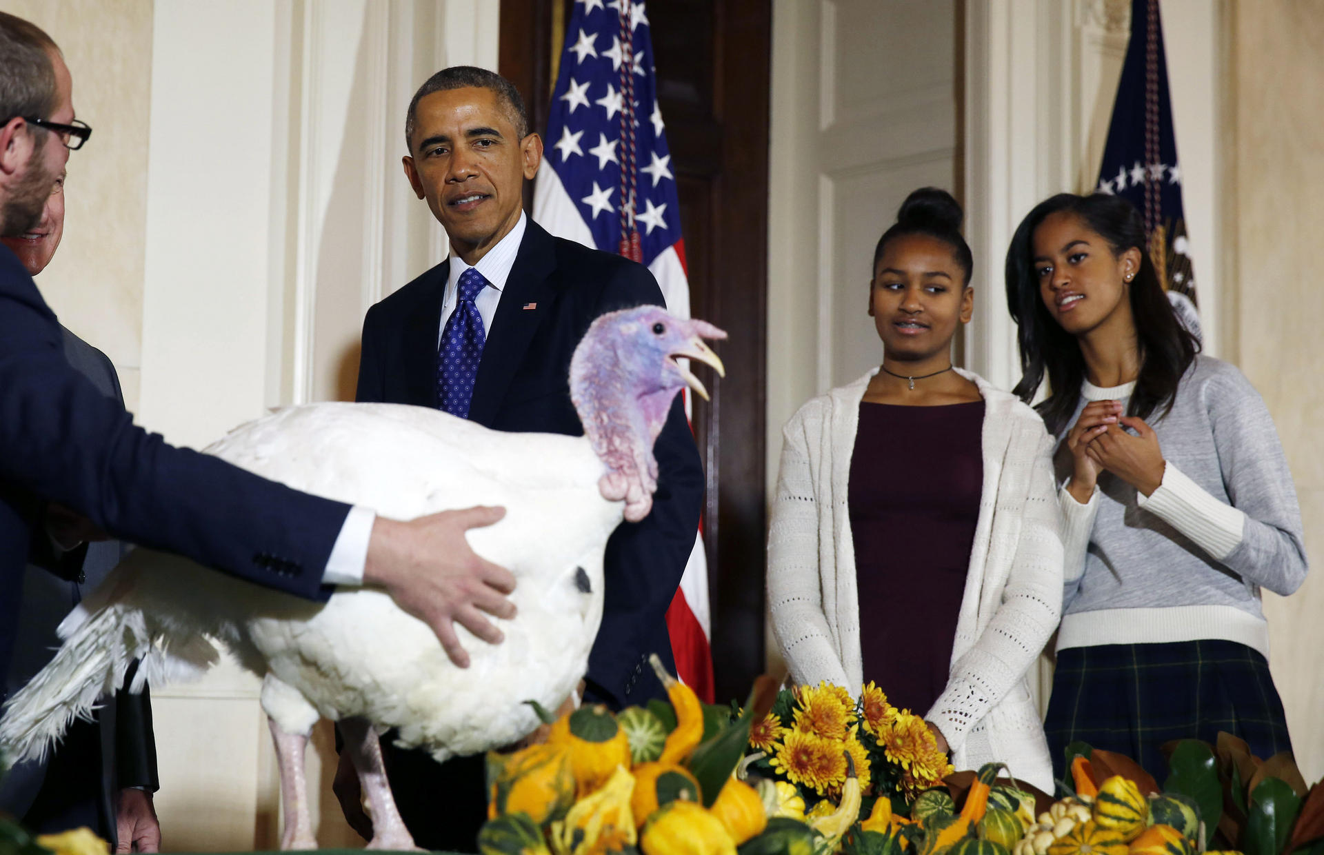 Barack Obama is joined by daughters Sasha and Malia (right) at the pardoning ceremony. Photo: Reuters