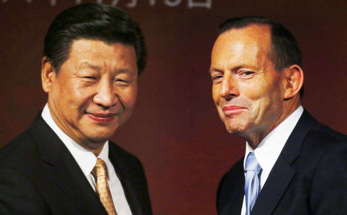 President Xi Jinping (left) and Australian Prime Minister Tony Abbott have agreed to improve military cooperation between the two states. The two leaders met in Sydney last month. Photo: AFP