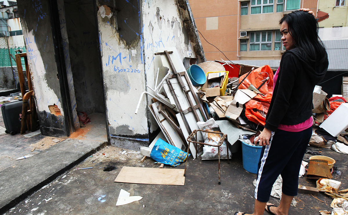 A Filipino woman living in a subdivided flat in a dilapidated state in North Point. Photo: Dickson Lee