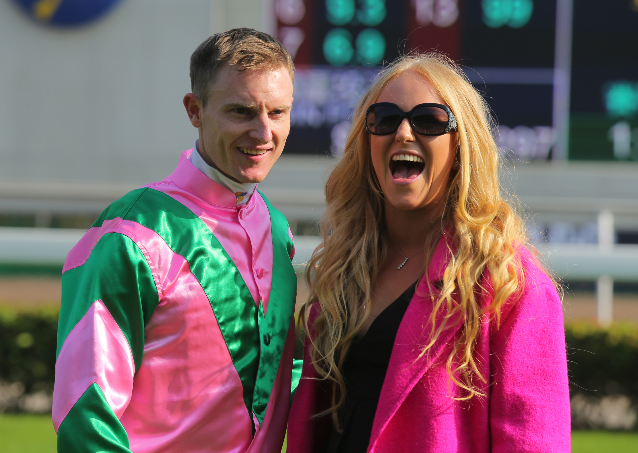 Zac Purton celebrates his Hong Kong Sprint win with wife Nicole. Photo: Kenneth Chan