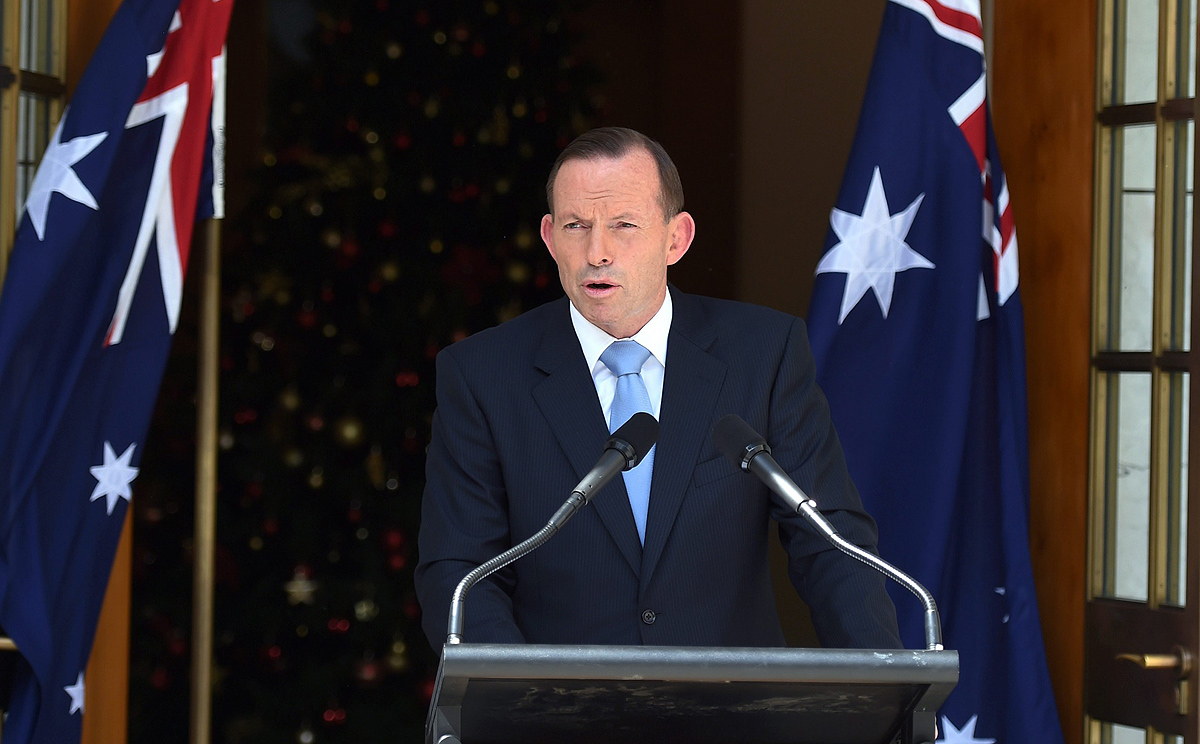 Tony Abbott gives details of his ministerial reshuffle at Parliament House in Canberra on Sunday. Photo: EPA