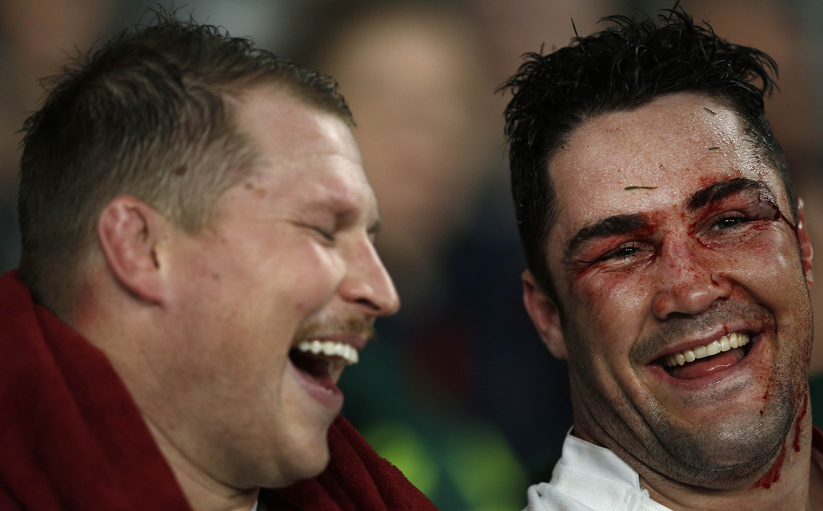 England team-mates Dylan Hartley (left) and Brad Barritt share a joke as they sit on the bench during the autumn international against Australia. Hartley could be banned until after the 2015 Six Nations have started after he was sent off in the English Premiership last weekend. Photo: AFP