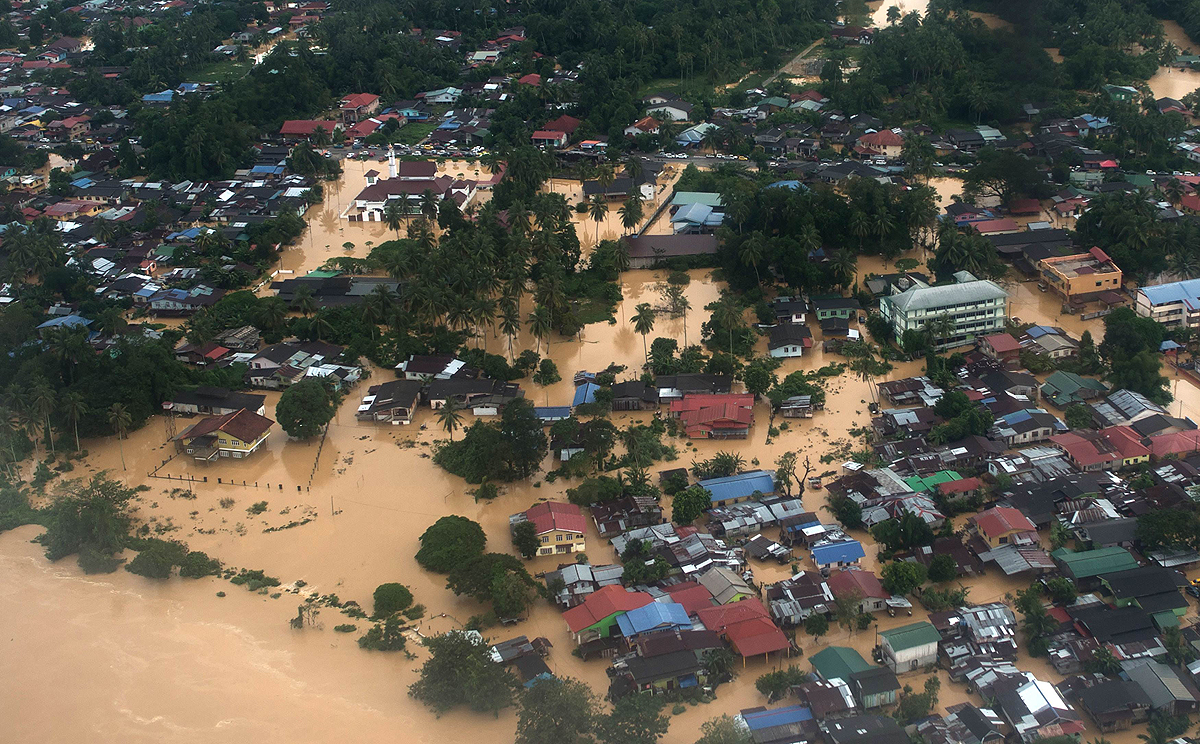 Aerial view shows houses submerged under flood waters in Pengkalan Chepa, near Kota Bharu on Saturday. Photo: AFP
