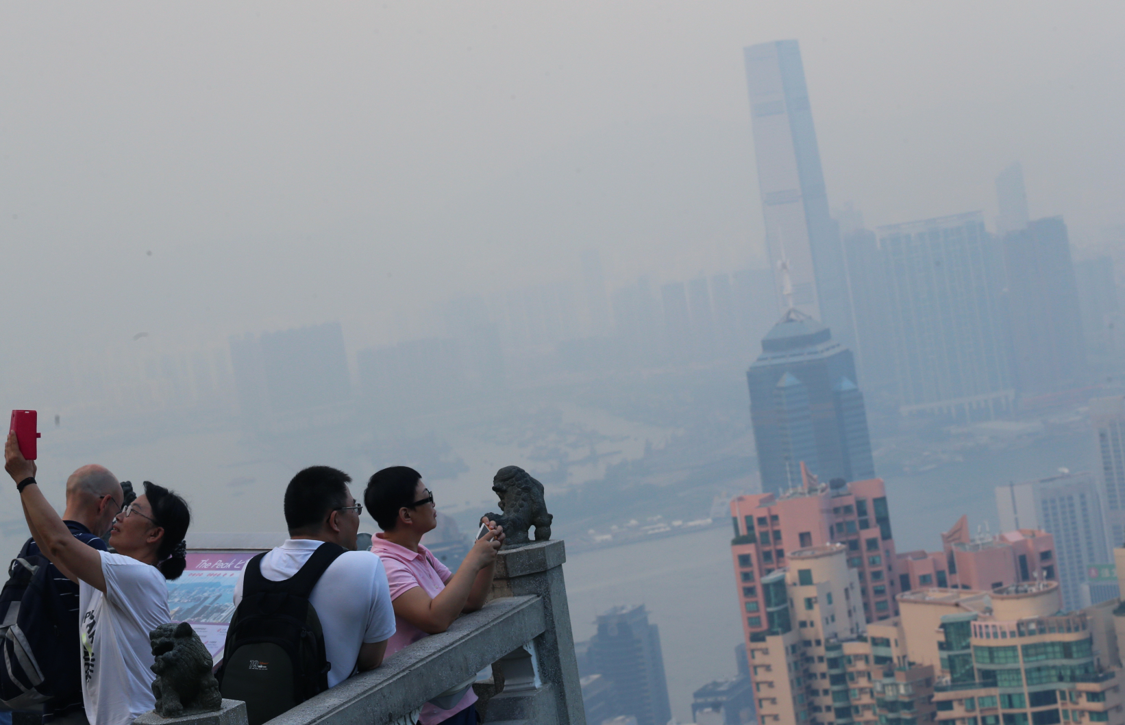 The air quality index now warns us of health risks. But what's next? Do we hide indoors during "serious" health risk days? Photo: David Wong