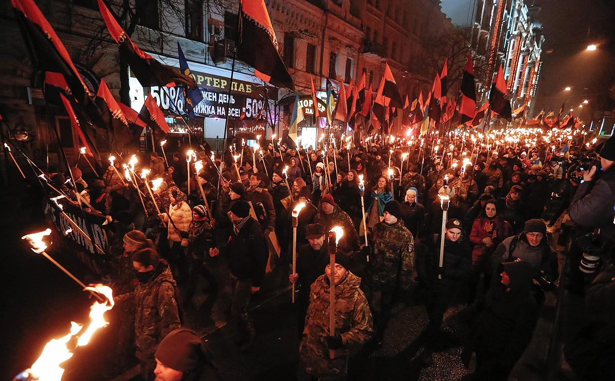 Ukrainian nationalists carry torches during a march to mark the 106th anniversary of right wing world war two resistance fighter Stepan Bandera's birth, in Kiev on Thursday. Photo: EPA