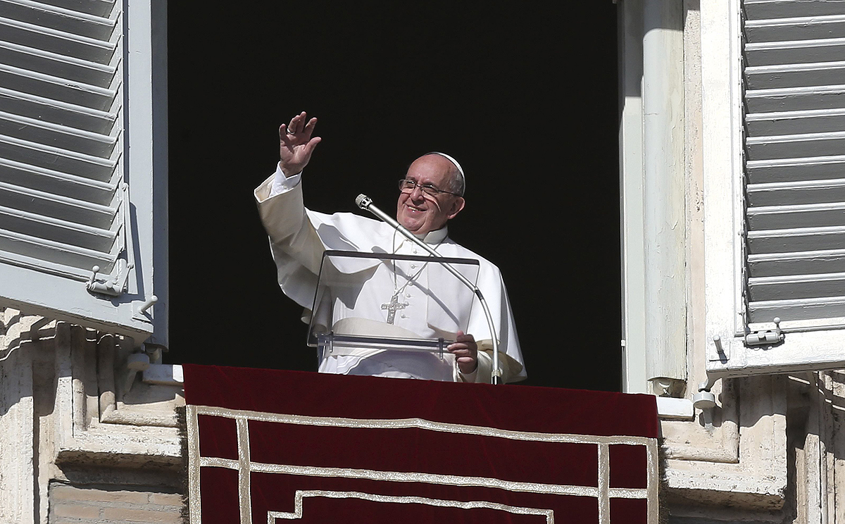 Pope Francis waves during his Angelus prayer in Saint Peter's Square at the Vatican on Sunday. Photo: Reuters