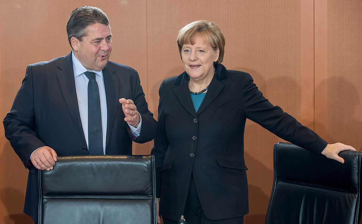 Germany's Deputy Chancellor Sigmar Gabriel with Chancellor Angela Merkel in Berlin in December 2014. Photo: AFP