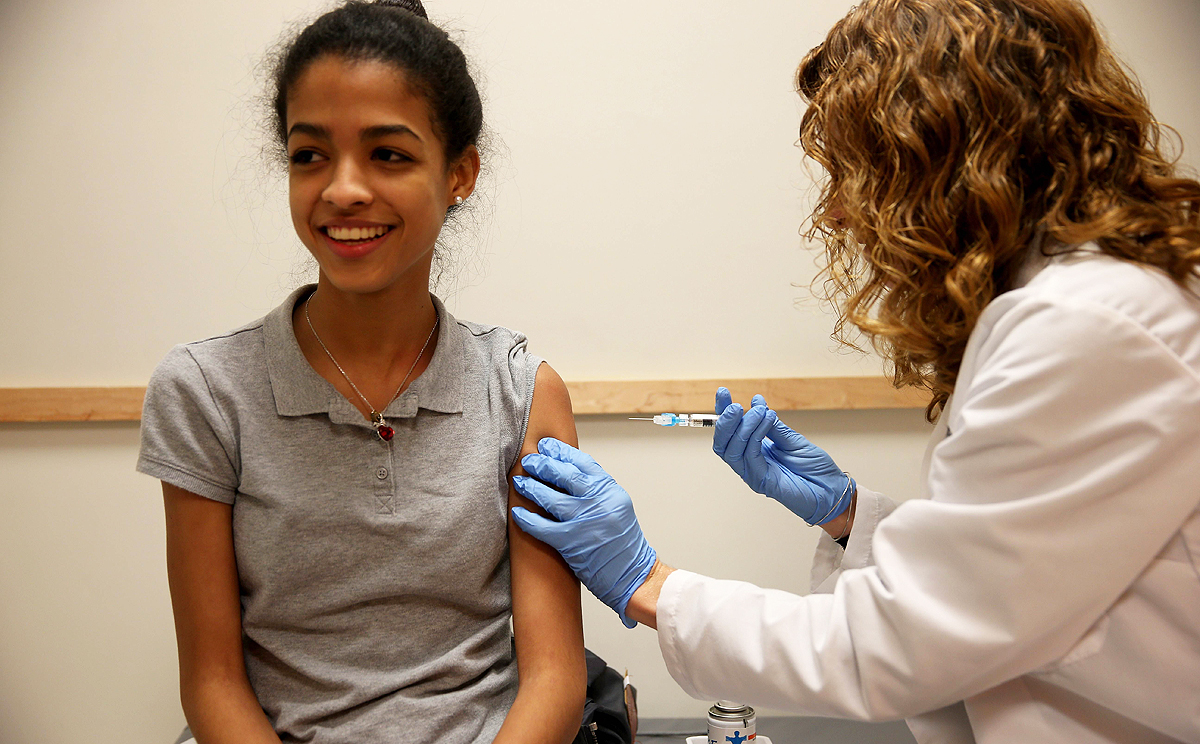 Doralissa Villaman,15, receives a flu vaccination during a visit to the Miami Children's Hospital on Thursday. Photo: AFP