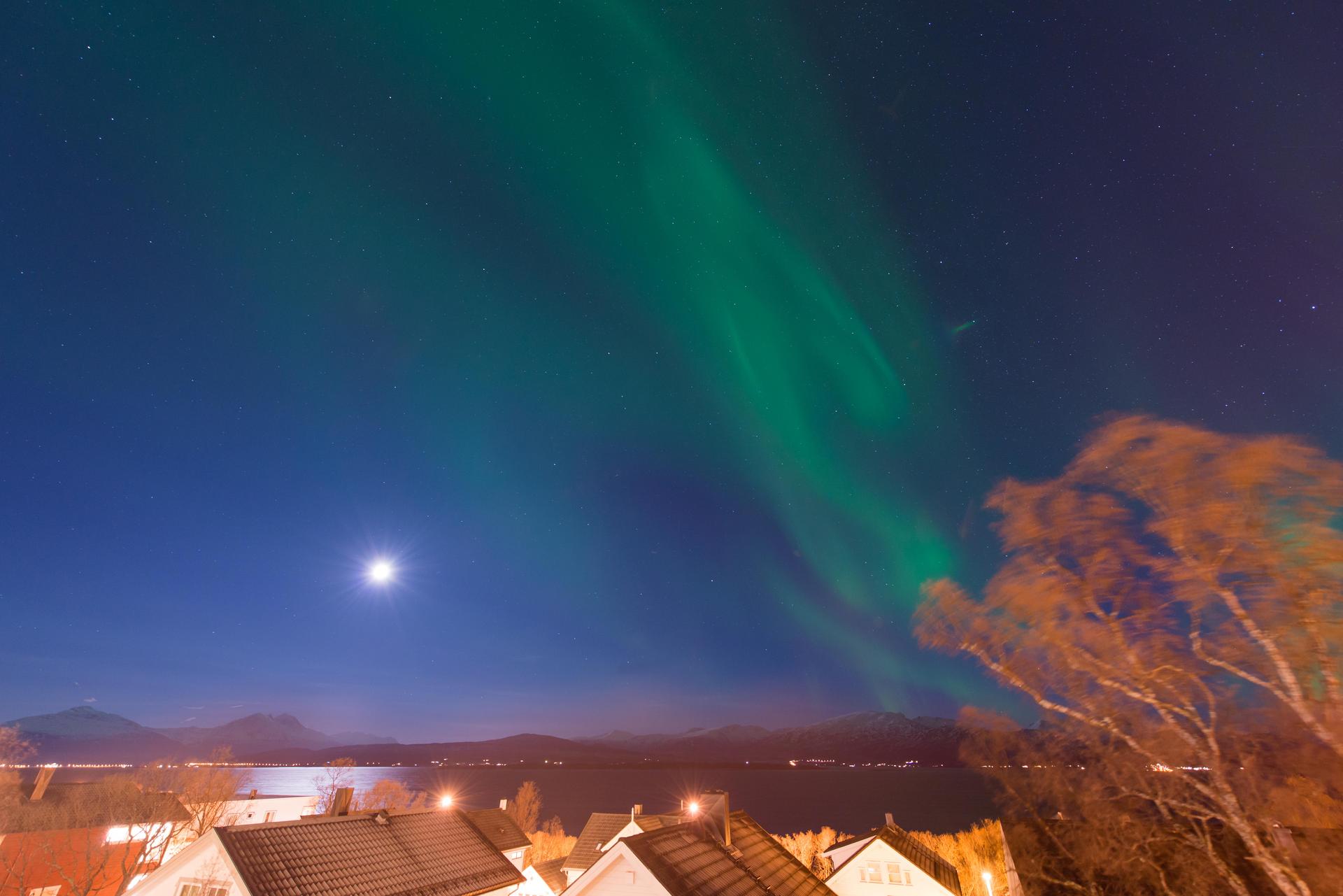 The Norwegian sky lit up by the Northern Lights and full moon. Photos: Corbis; Chris Graham; Truls Tiller