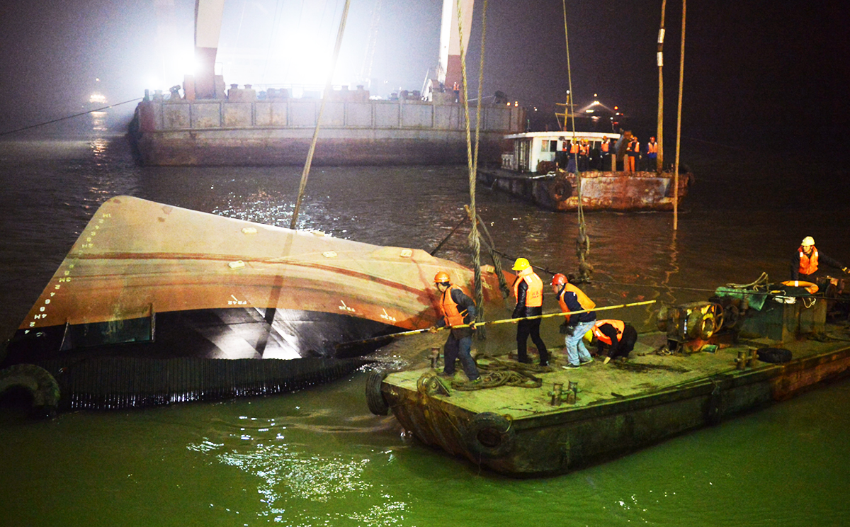 A Singaporean, Japanese nationals and a Frenchman, are among more than 20 people still missing after a tug boat overturned and sank in the Yangtze River last night. Photo: Xinhua