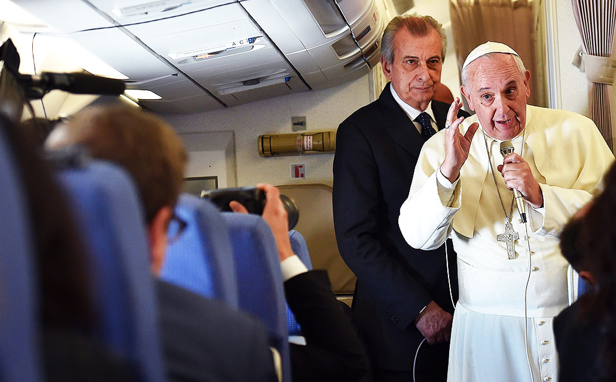 The pope speaks to journalists on board the papal jet, where he addressed the church's views on birth control. Photo: EPA