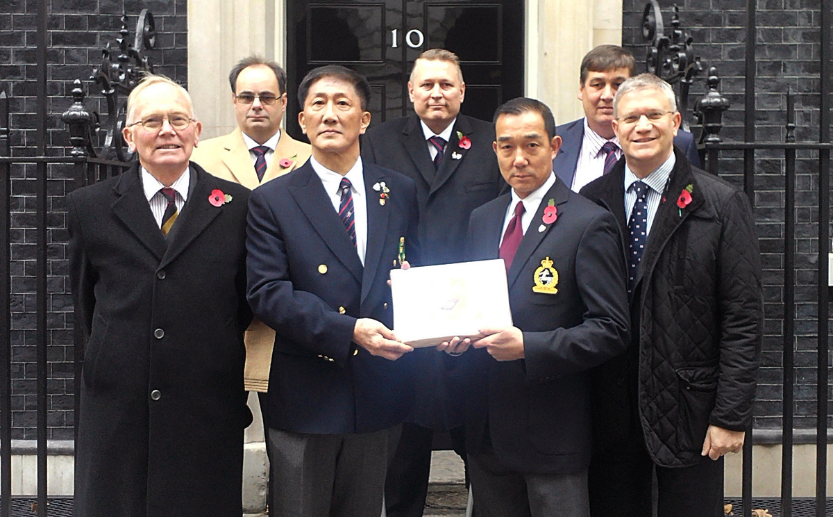 Roger Ching stands second left in the front row, with Andrew Rosindell on the right, as the campaign was taken to Downing Street in November. Photo: SCMP Pictures