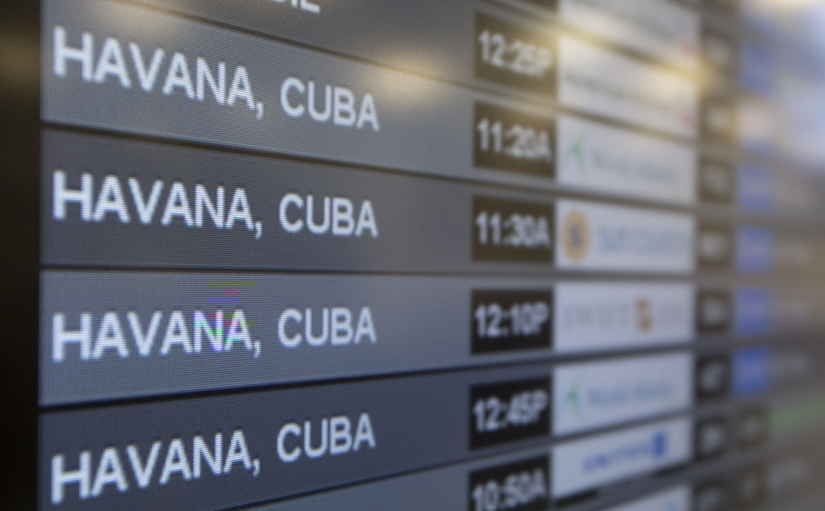 Charter flights to Havana are shown on a departures screen at Miami International Airport on Friday following the easing of travel restrictions. Photo: AP