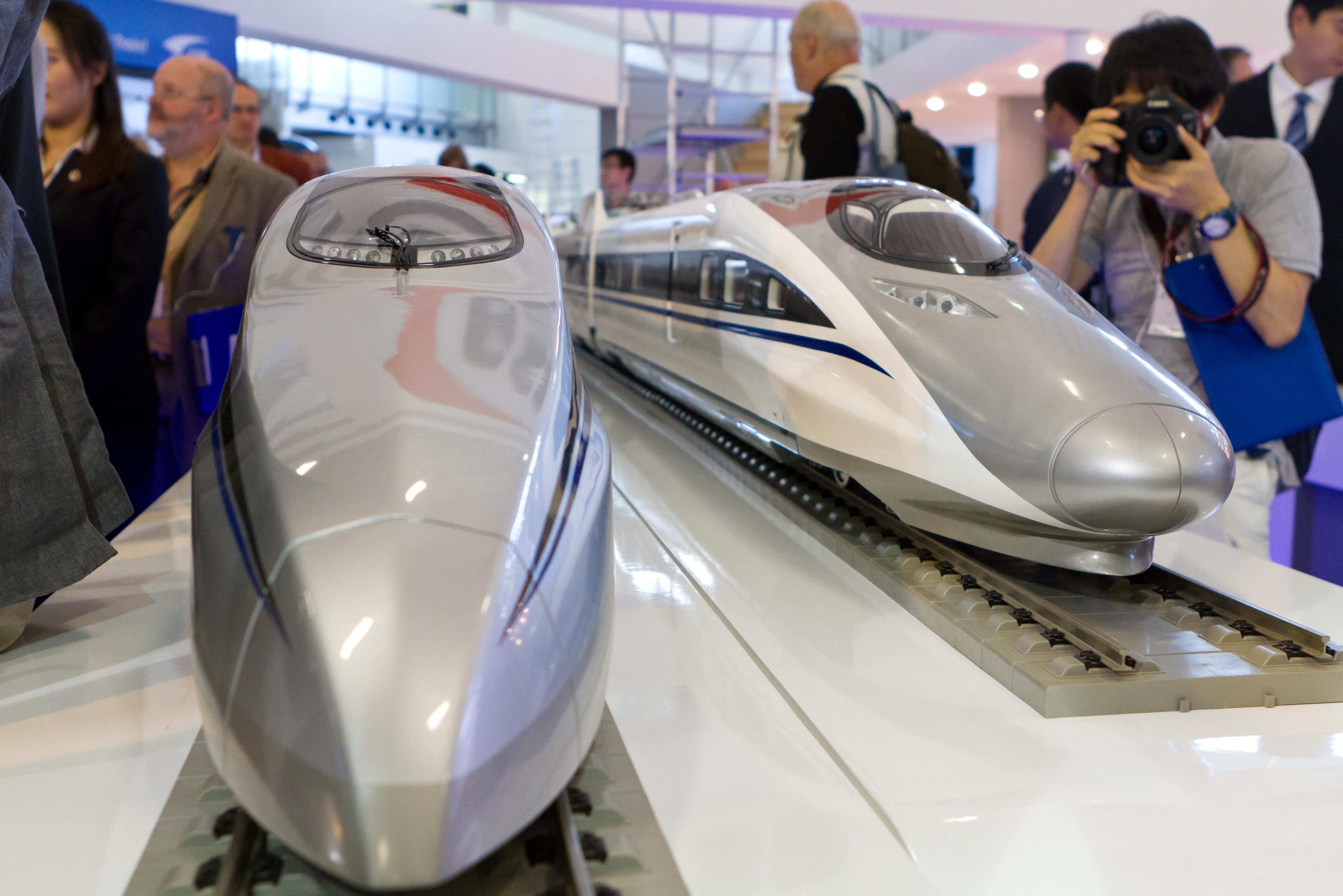 High speed train models from China are on display. China CSR and China CNR both announce net profits while saying a merger of the two has received board approvals. Photo: EPA