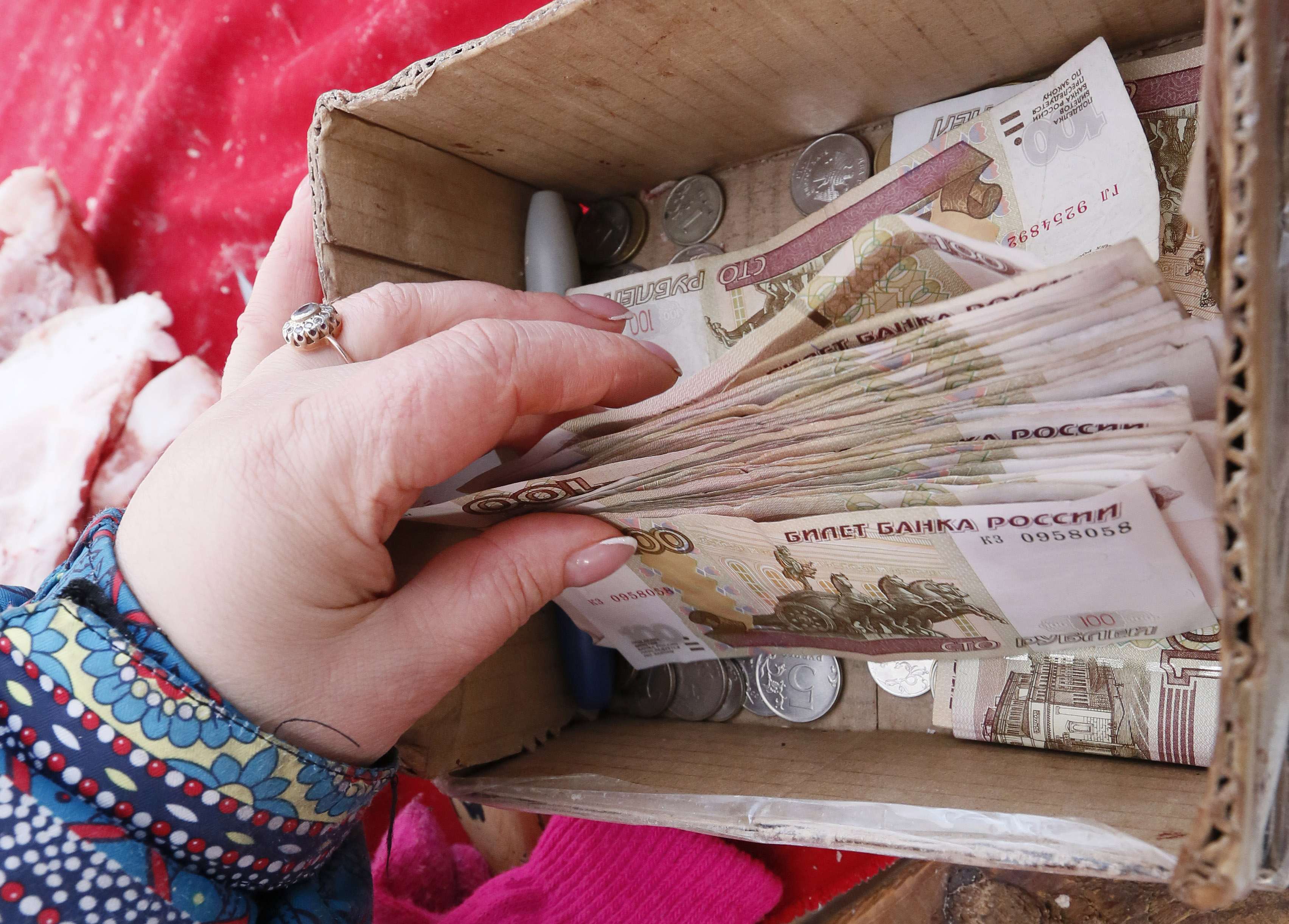 Roubles are placed in a cardboard box in Moscow as the Russian currency is in practical collapse and China says it will act to keep trade ties stable. Photo: Reuters