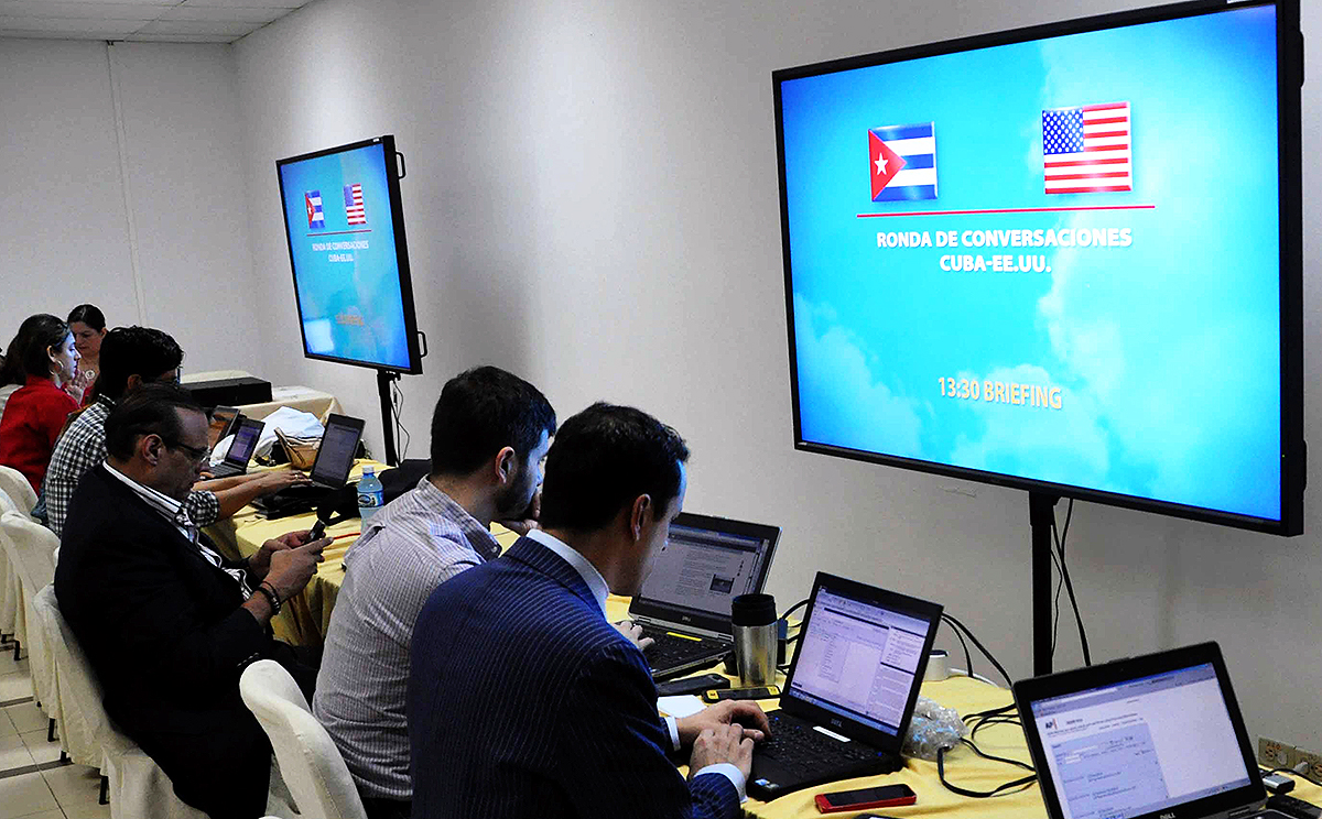 Journalists work at press room as delegates of the Unites States and Cuba meeting at the Palace of Convention in Havana. Photo: Xinhua
