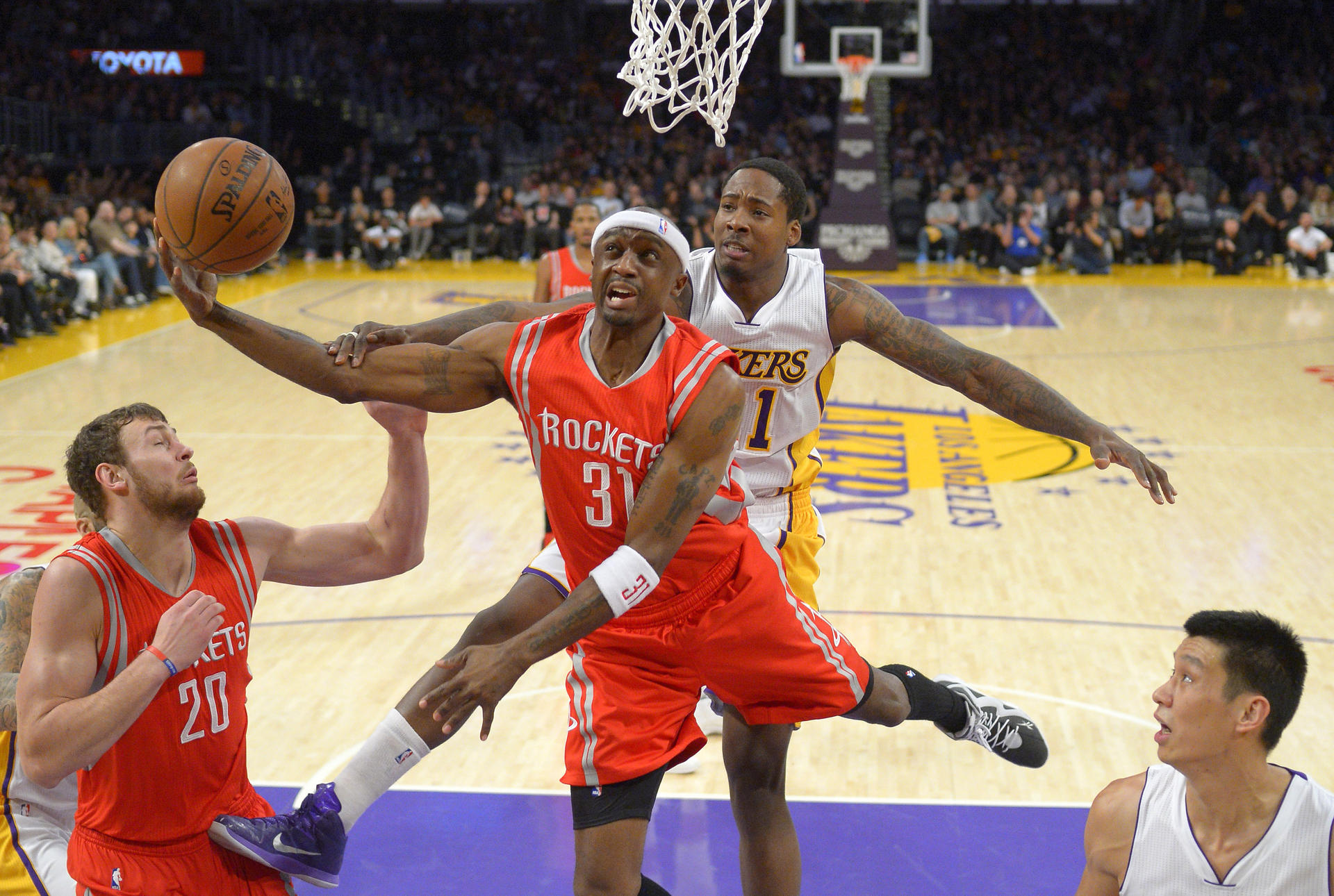 Houston Rockets guard Jason Terry is fouled by Lakers' Ed Davis, with Donatas Motiejunas (left) and Jeremy Lin looking on. Photo: AP