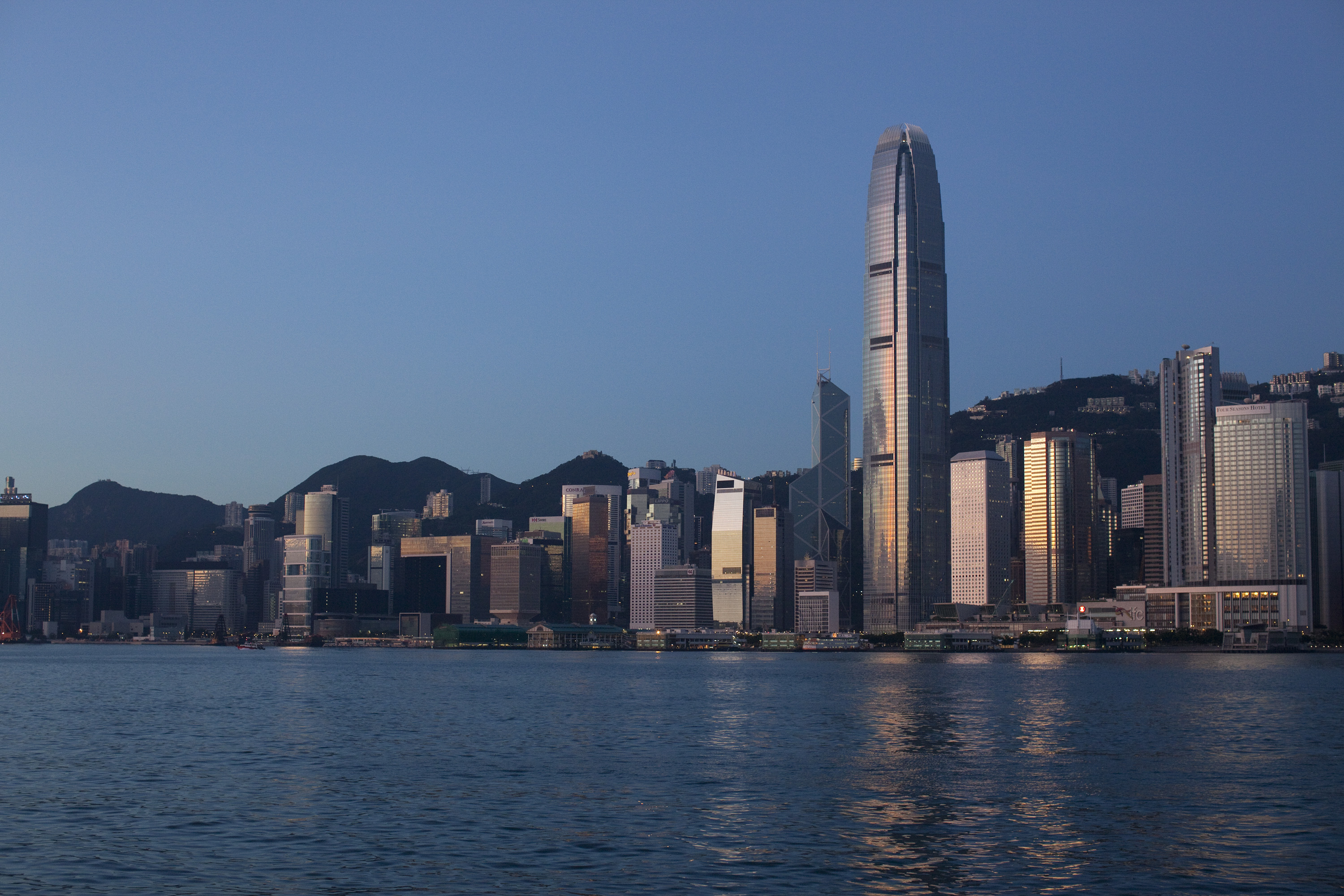 Hong Kong's skyscrapers gleam at sunrise as the government needs to take steps to develop commercial office space. Photo: Bloomberg