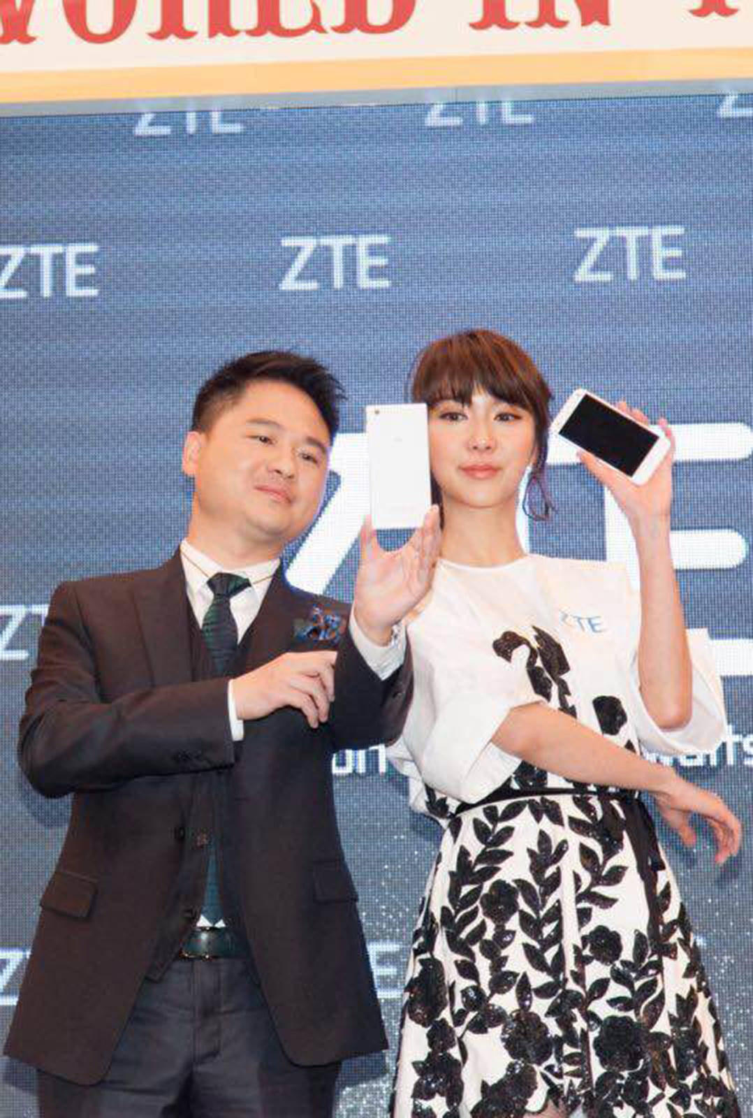 Adam Zeng with singer Fiona Sit at the launch of the new smartphone. Photo: SCMP Pictures