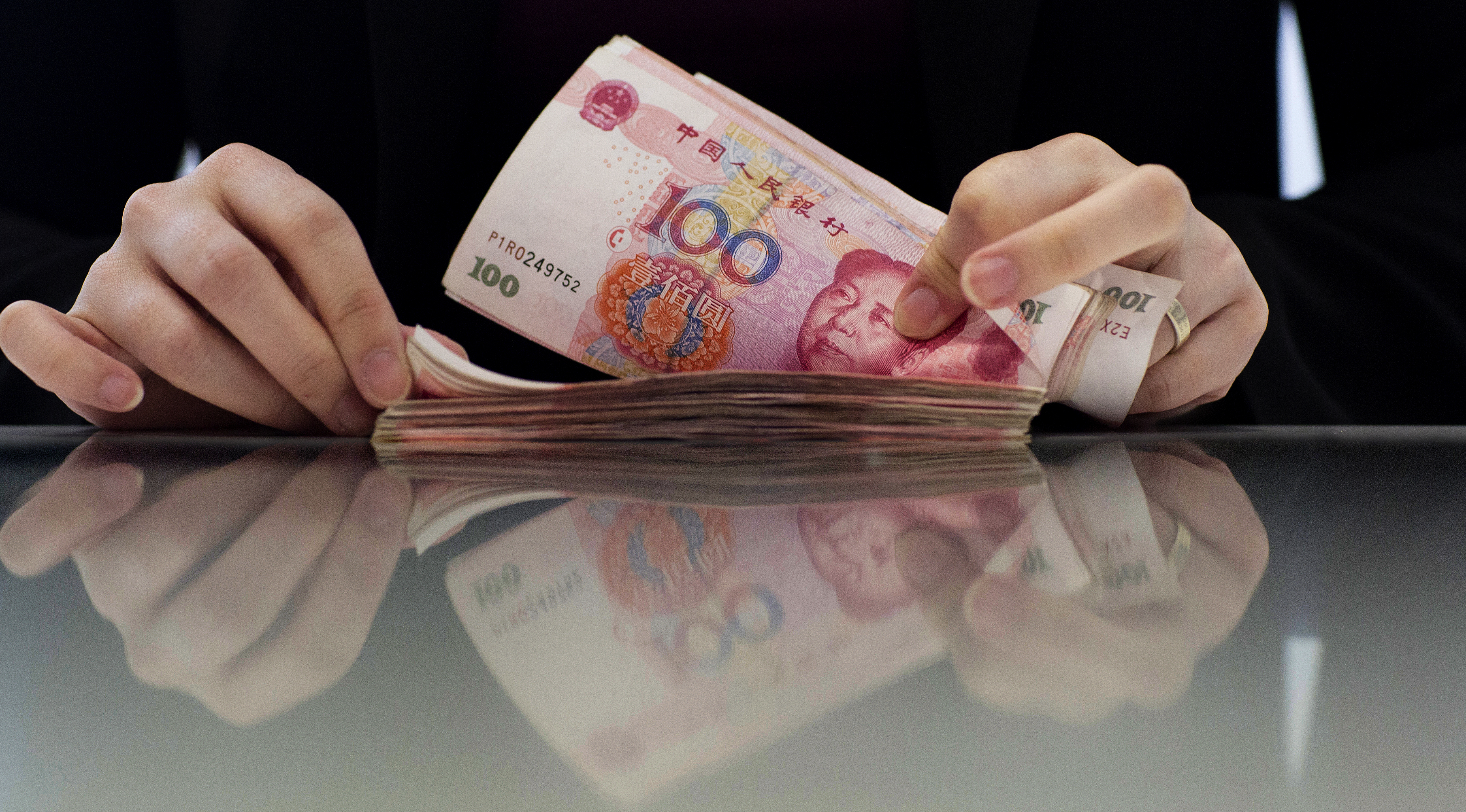 The yuan's mild appreciation trend should remain intact in the medium term, supported by an external surplus. Photo: Bloomberg