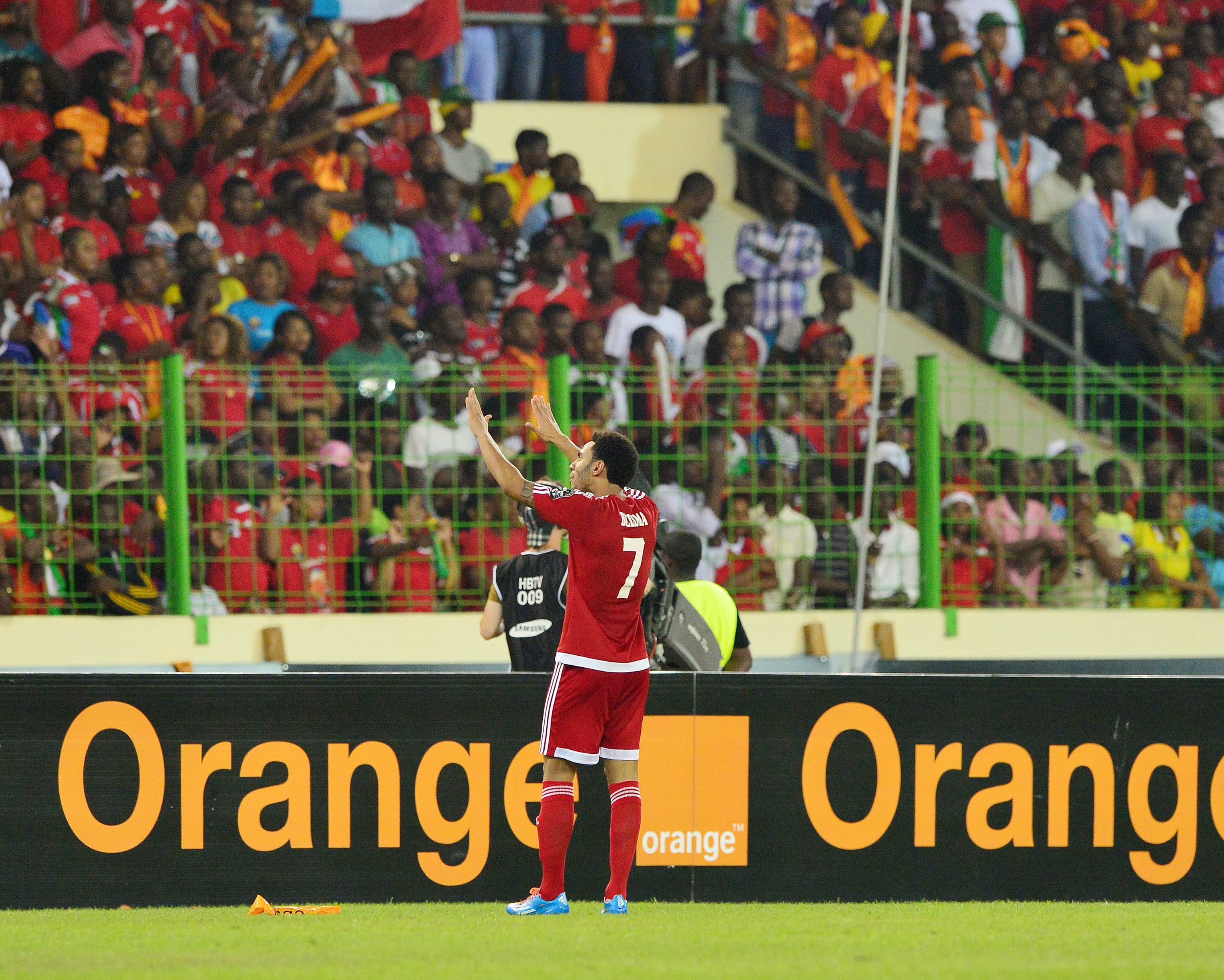 Reuban Belima of Equatorial Guinea pleads for calm from the crowd during a stormy semi-final encounter between Ghana and Equatorial Guinea during a sporadically violent Africa Cup of Nations. Photo: EPA