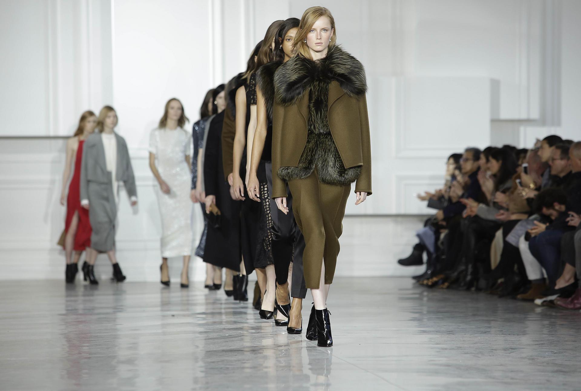 Jason Wu's New York Fashion Week show contrasted elegant tailored suits, jackets, coats and trousers with body-clinging sheath dresses with cut-out backs and thigh-revealing splits. Photo: AFP